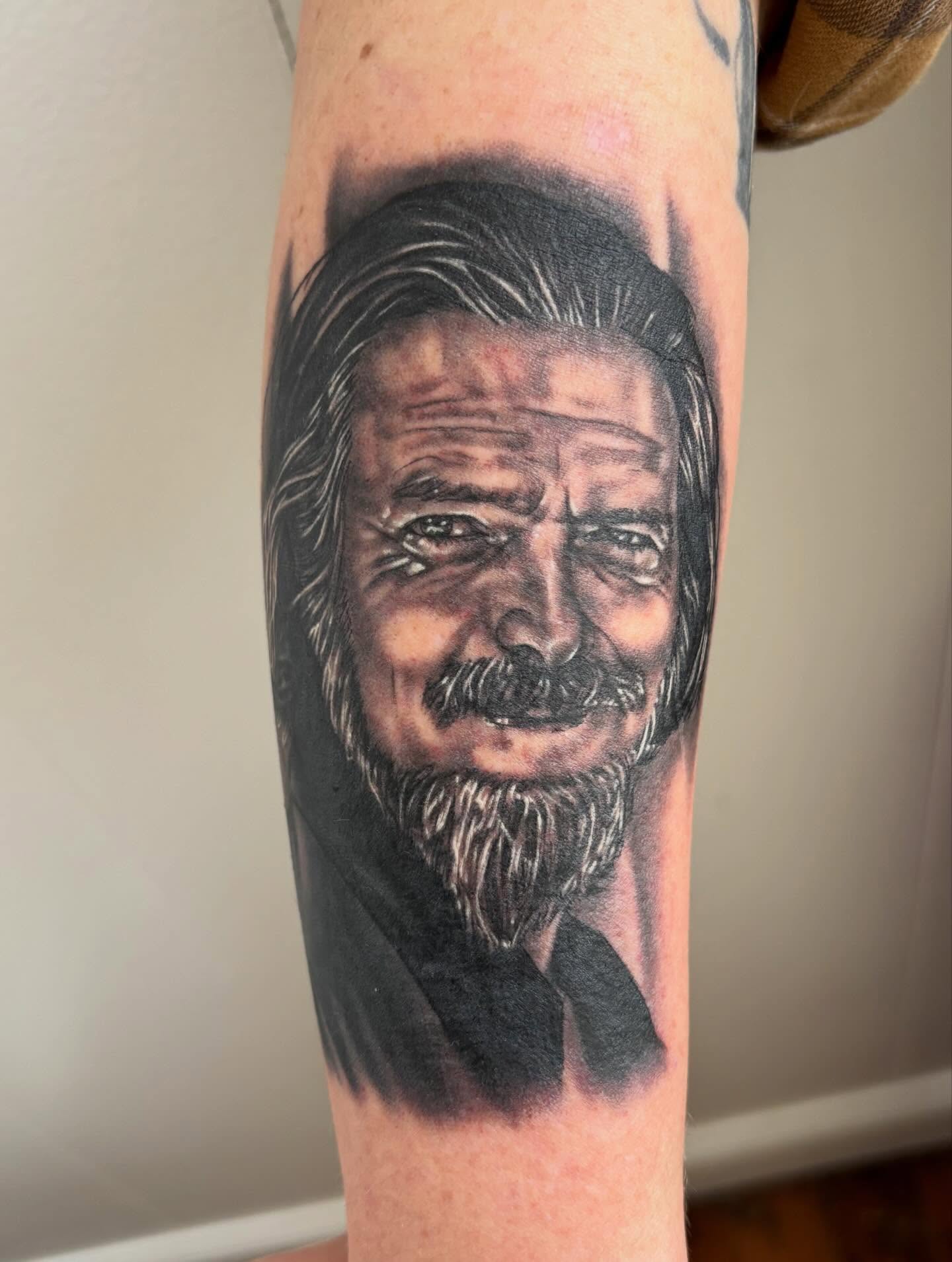 Portrait realism tattoo on the forearm by Taylor Santavicca