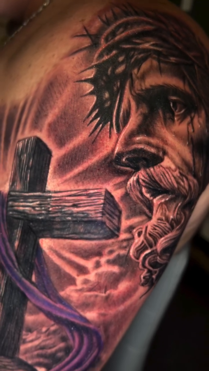 Jesus Christ and a cross realism tattoo by Monstro Ink Arts Tattoos, Bakersfield, California