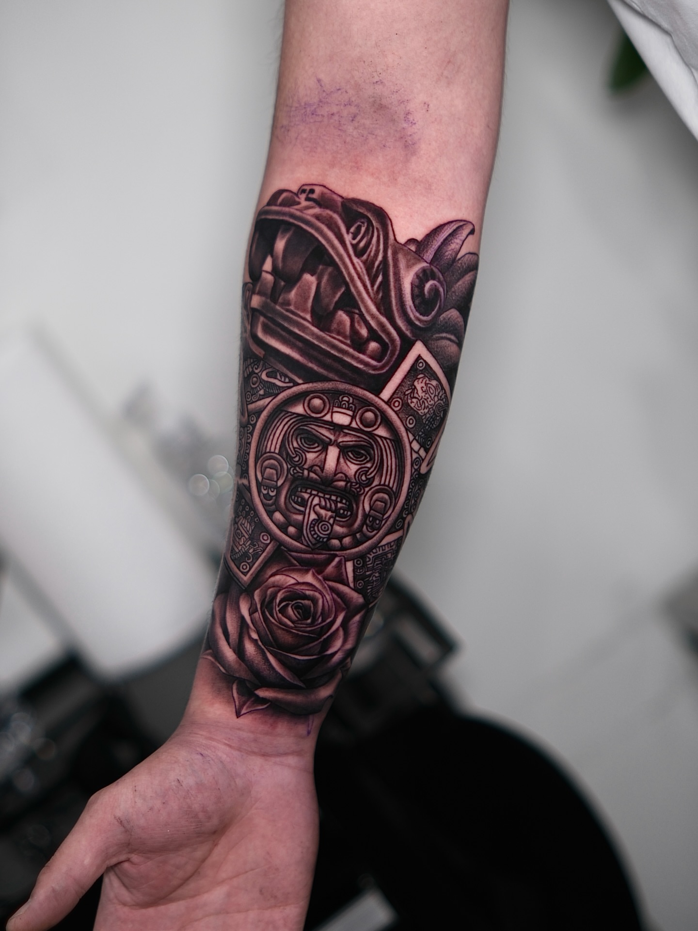 Mexican mask and rose realism tattoo on the forearm by Dallas tattoo artist