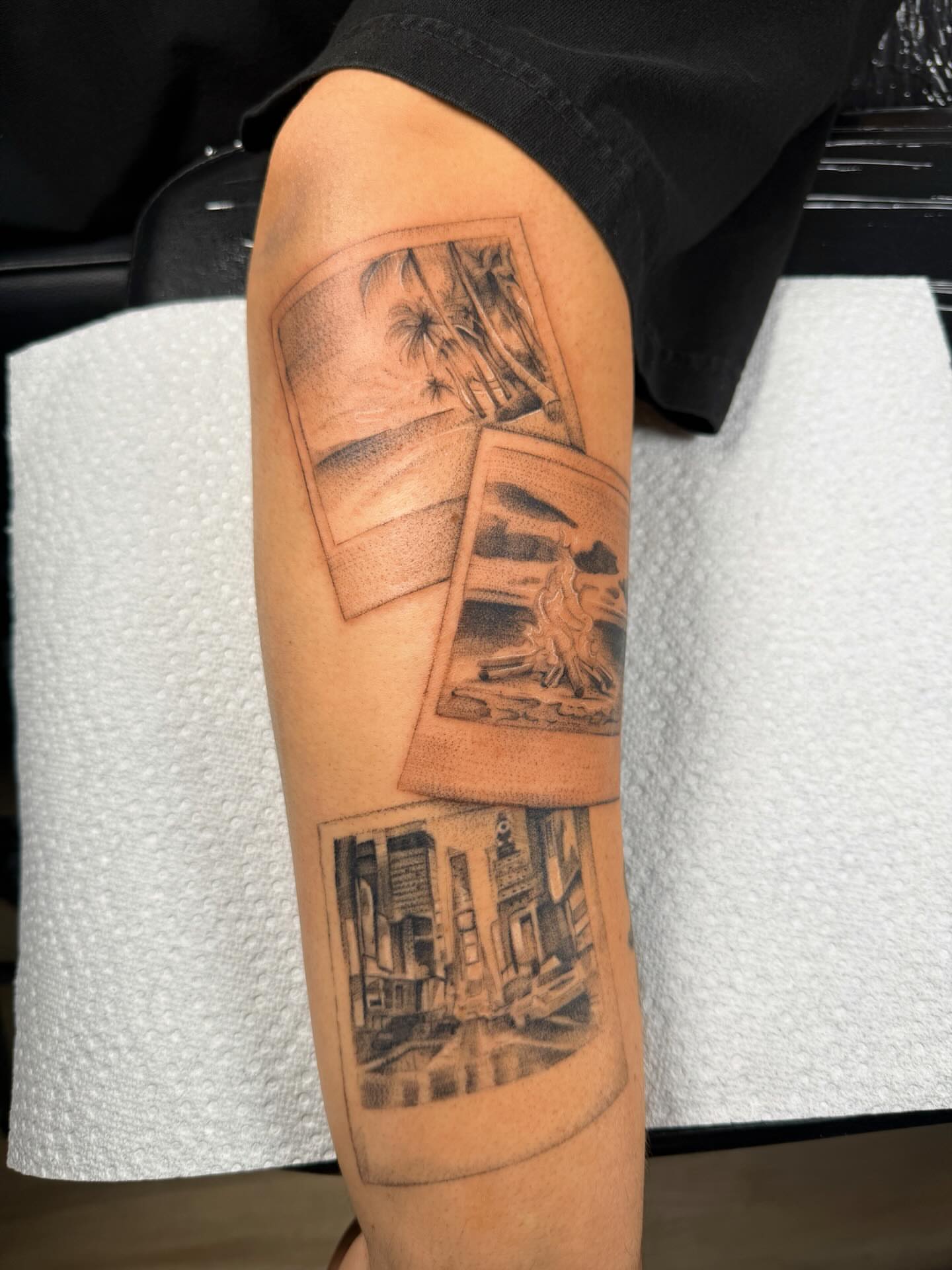 Photographs black and grey tattoo on the forearm by Nate Weaver