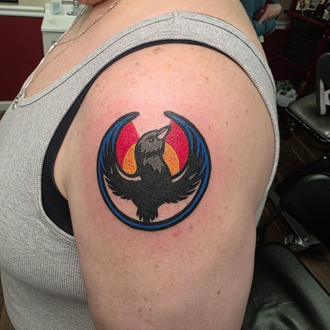 Raven with wings spread tattoo on the shoulder by Bosco Layne