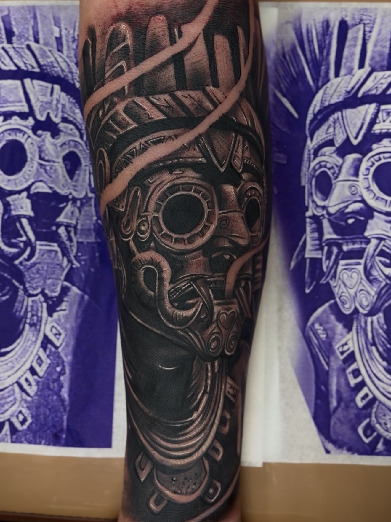 Ancient mask realism tattoo on the forearm by Raul Rodriguez