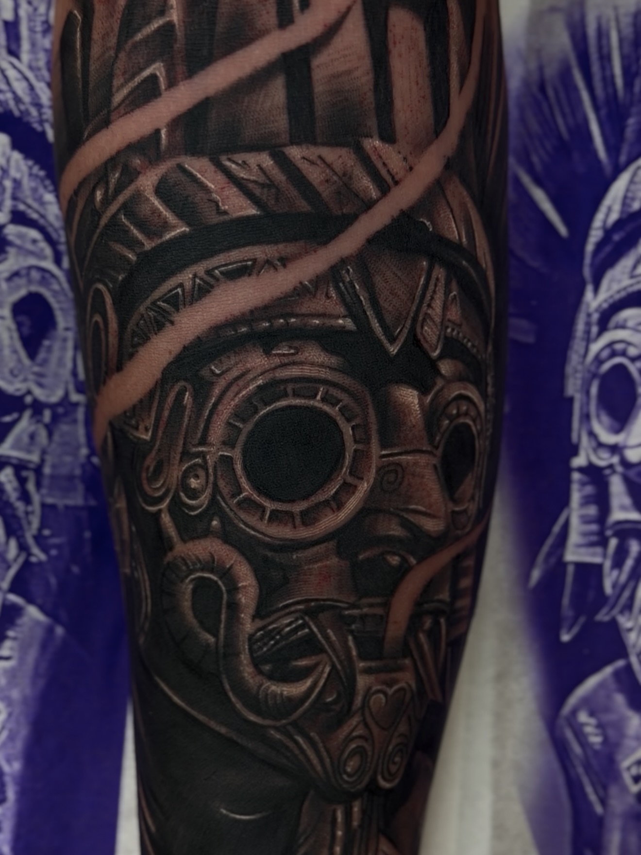 Mechanical mask realism tattoo on the forearm by Raul Rodriguez