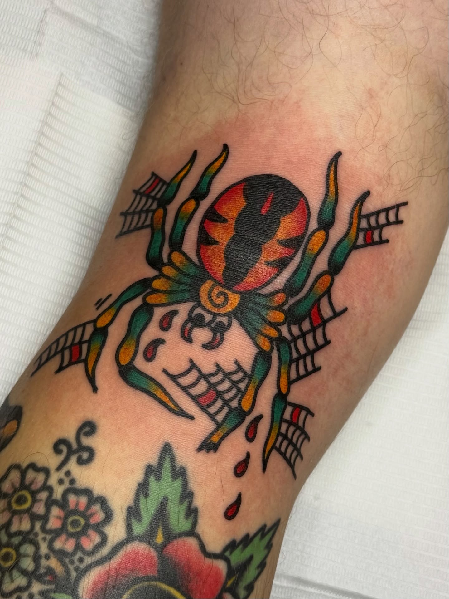 Jester skull American traditional tattoo on the forearm by Roman