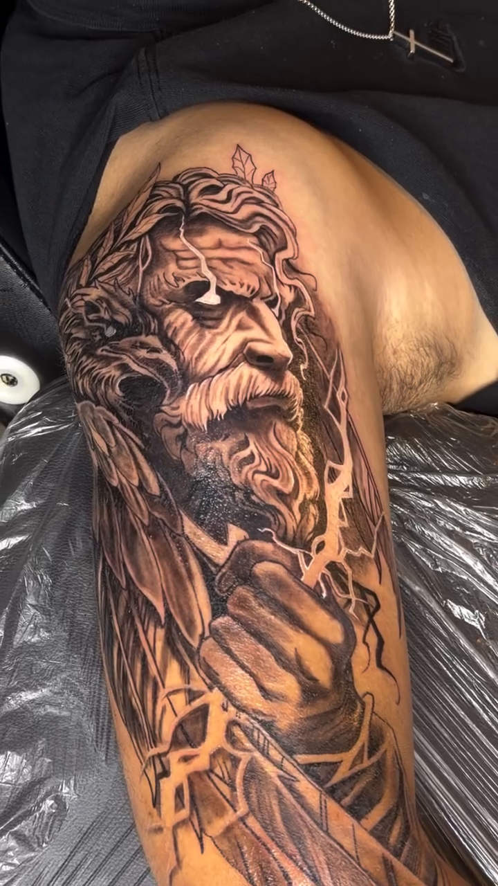 Portrait of a bearded man realism tattoo on the upper arm by 🐺