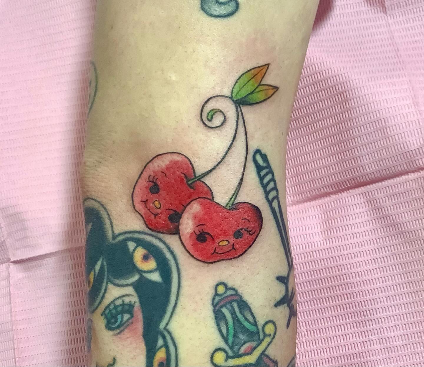 Cherry new school tattoo on the forearm by Hannah Hahn