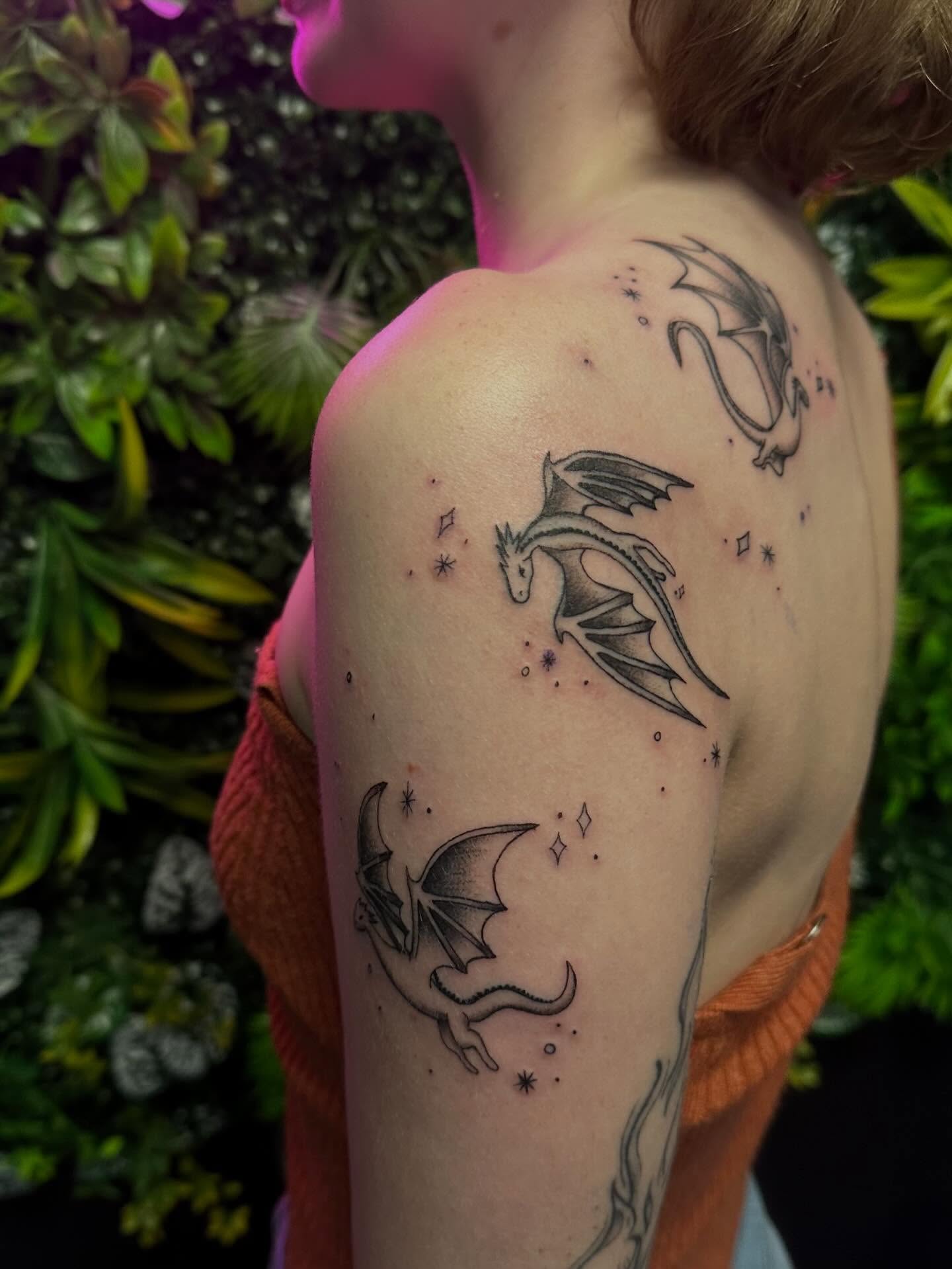 Dragons dotwork tattoo on the shoulder by Melissa