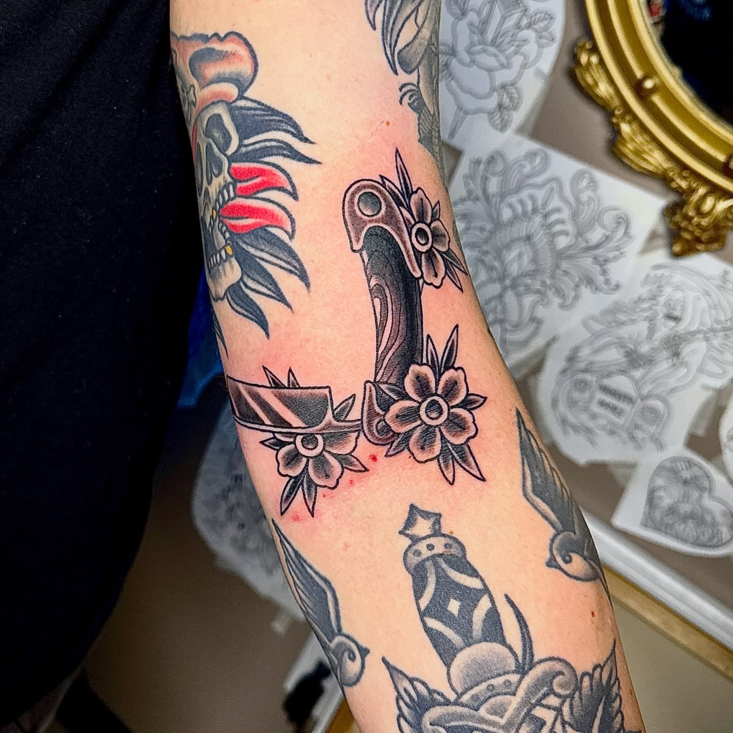 Skull and flowers American traditional tattoo on the forearm by Derek Cilla, Bethlehem, Pennsylvania