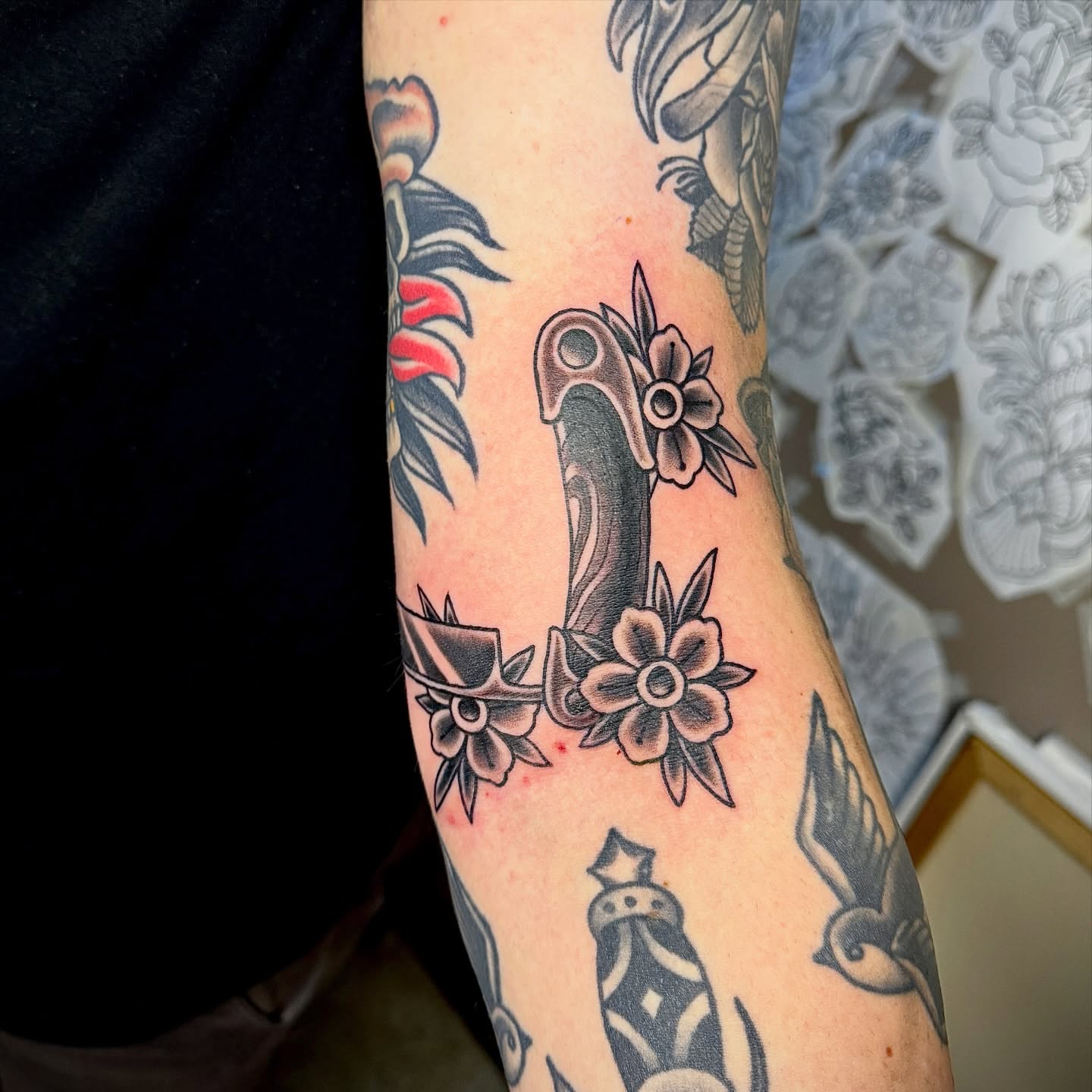 Knife and flowers American traditional tattoo on the forearm by Derek Cilla, Bethlehem, Pennsylvania