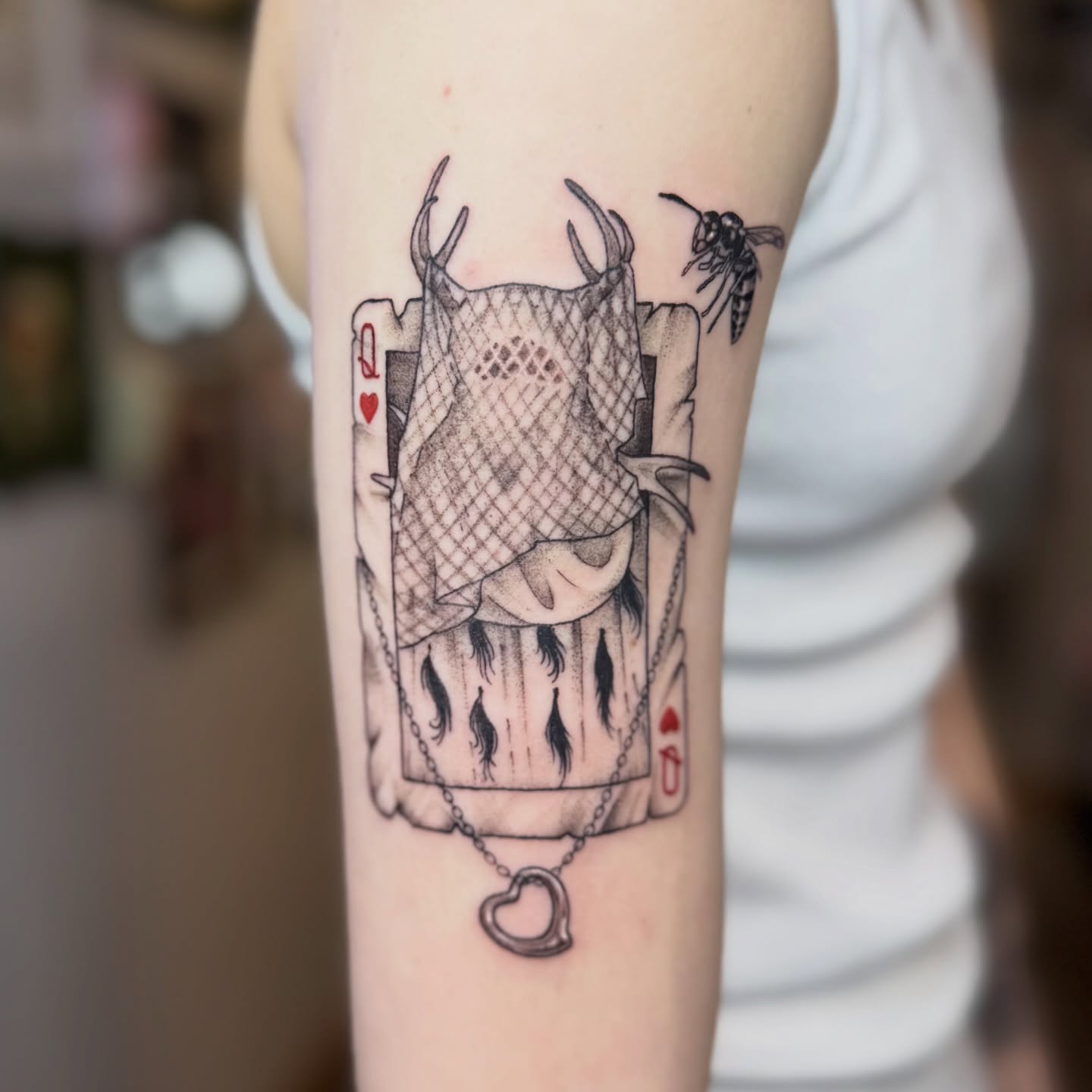 Playing card black and grey tattoo on the forearm by Erin Bratzler