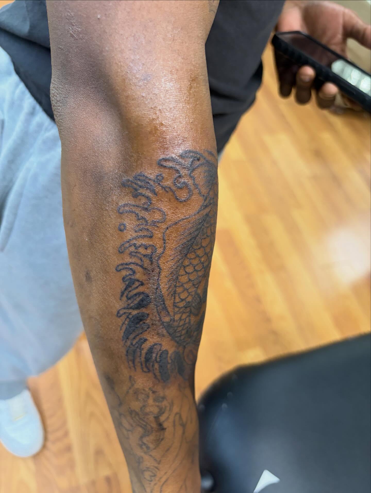 Dragon black and grey tattoo on the forearm by Jae the artist🫡