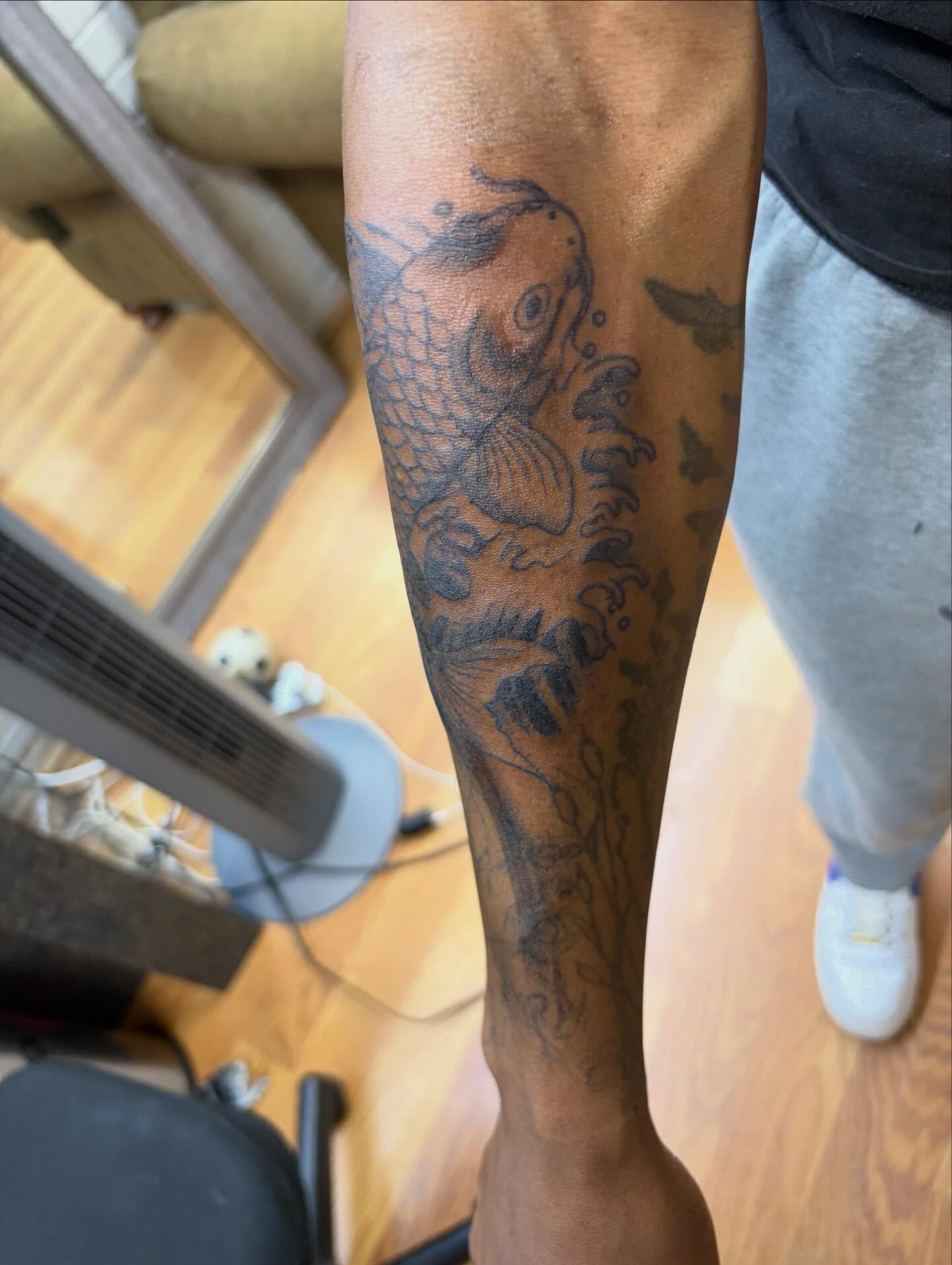 Koi fish black and grey tattoo on the forearm by Jae the artist🫡