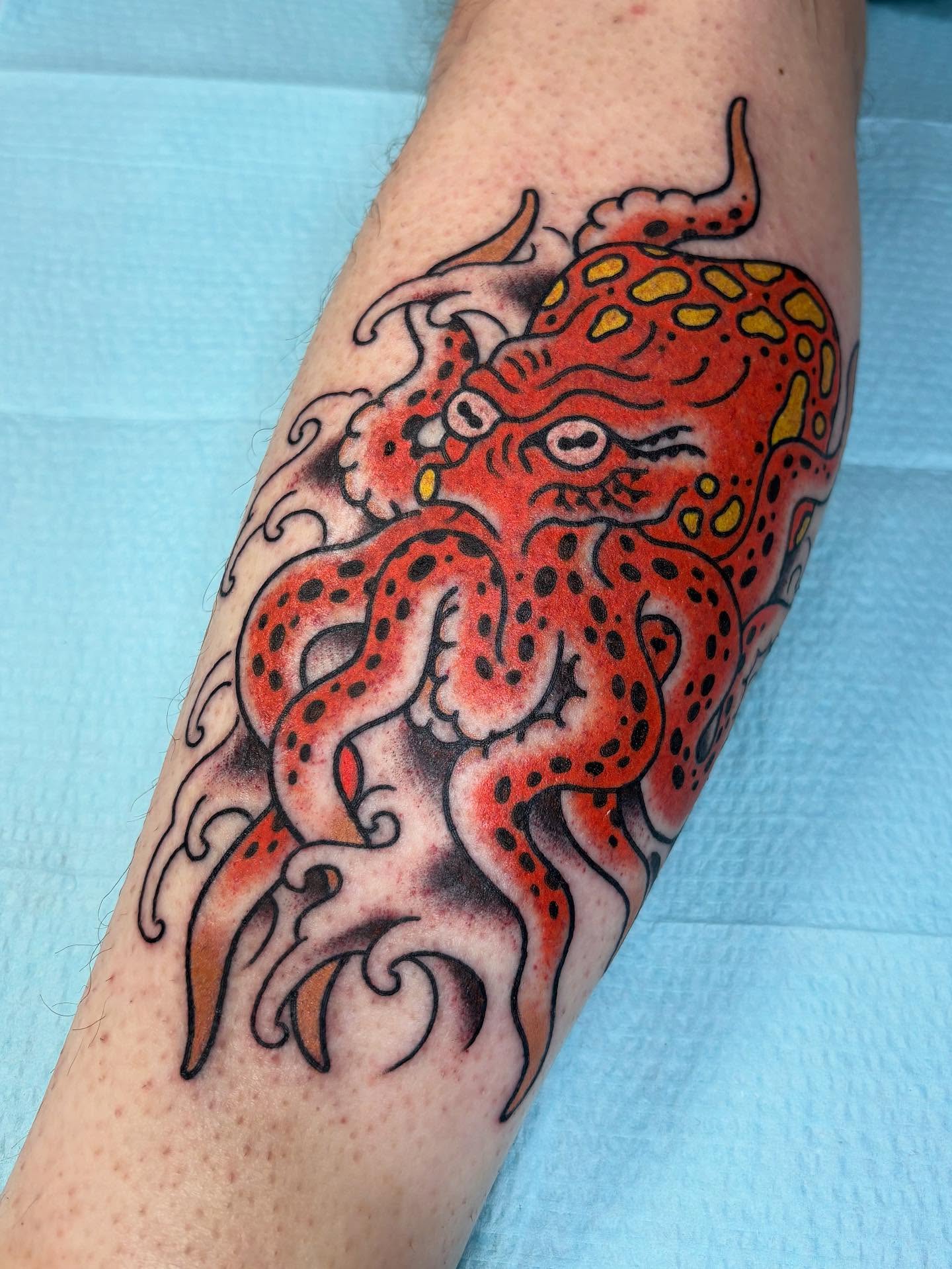 Octopus American traditional tattoo on the forearm by Tom Wenzell
