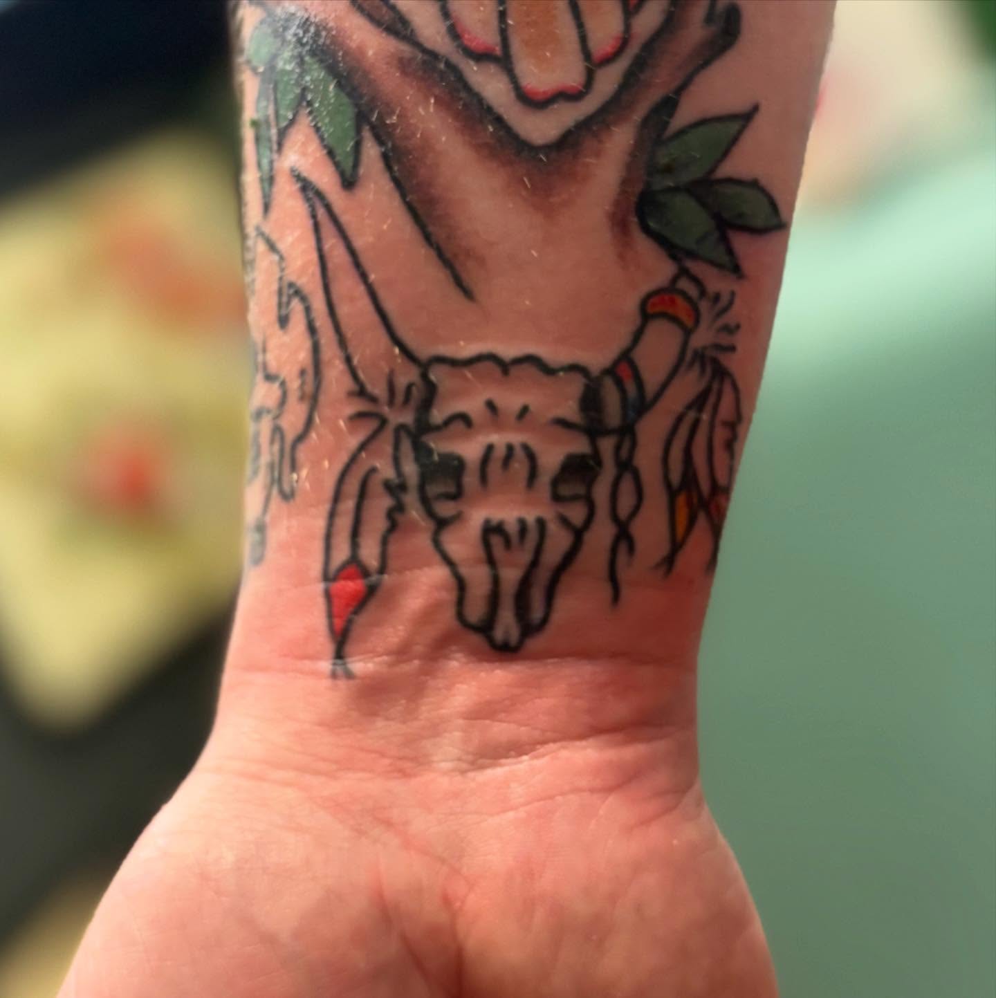Bull skull American traditional tattoo on the forearm by Columbus tattoo artist