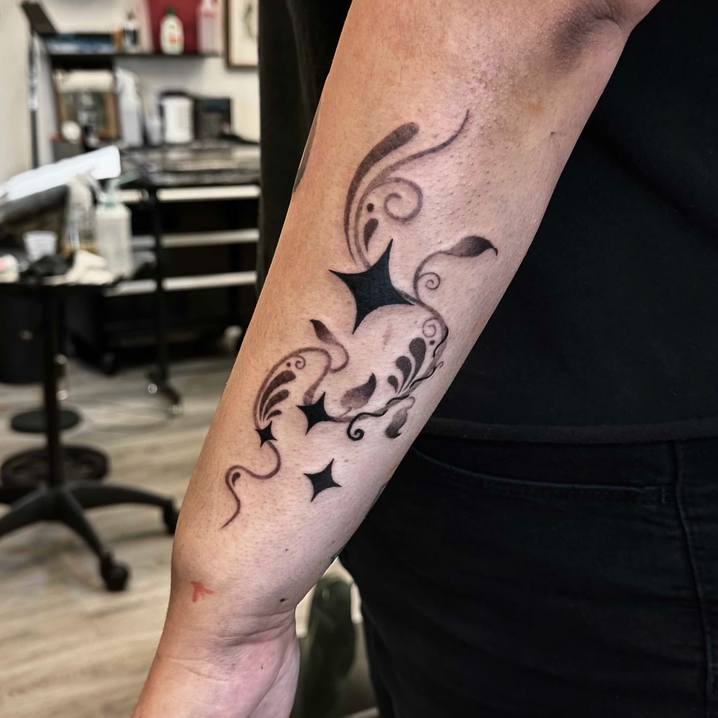 Octopus black and grey tattoo on the forearm by Xin Huang