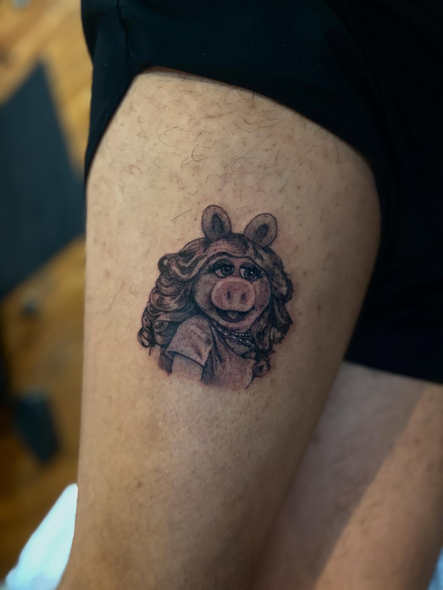 Miss Piggy realism tattoo on the thigh by Dylan Coverdale