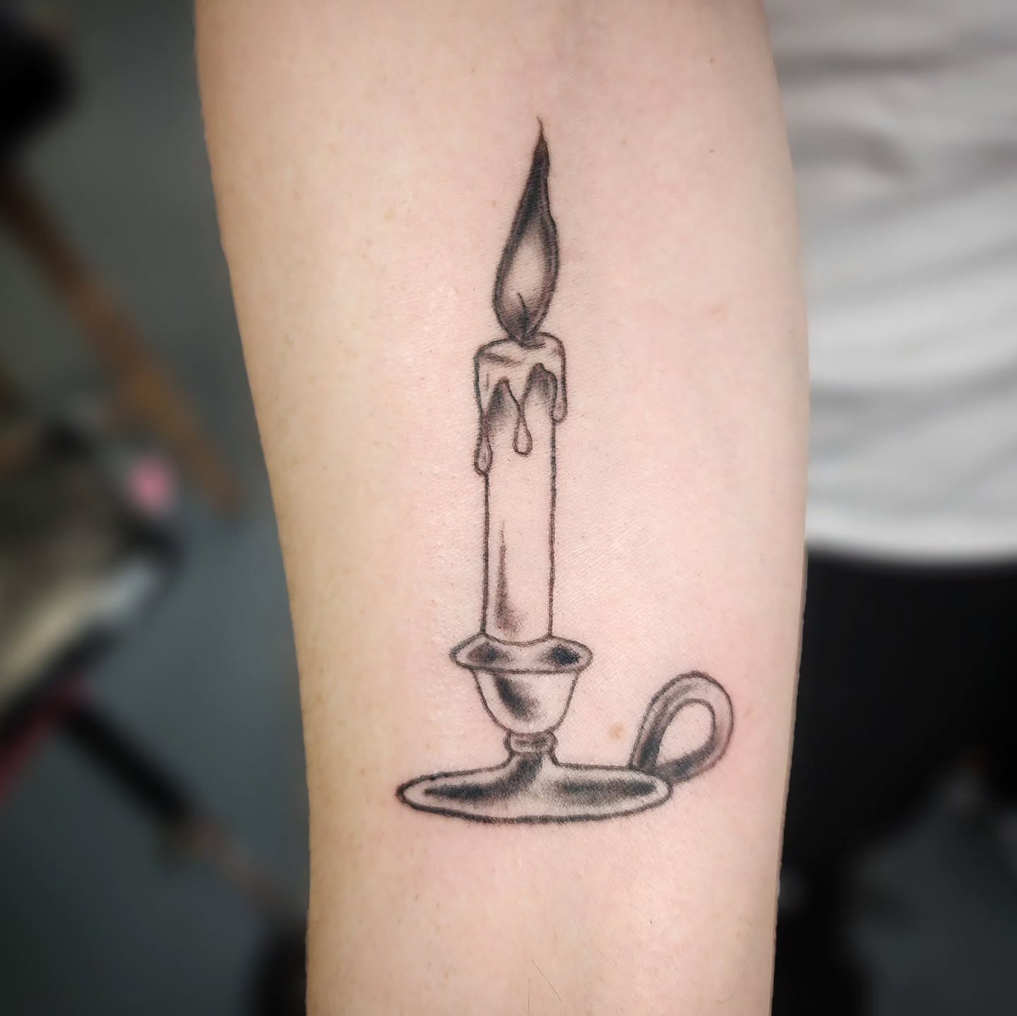 Candle black and grey tattoo on the forearm by Anntonietta Borzacchiello