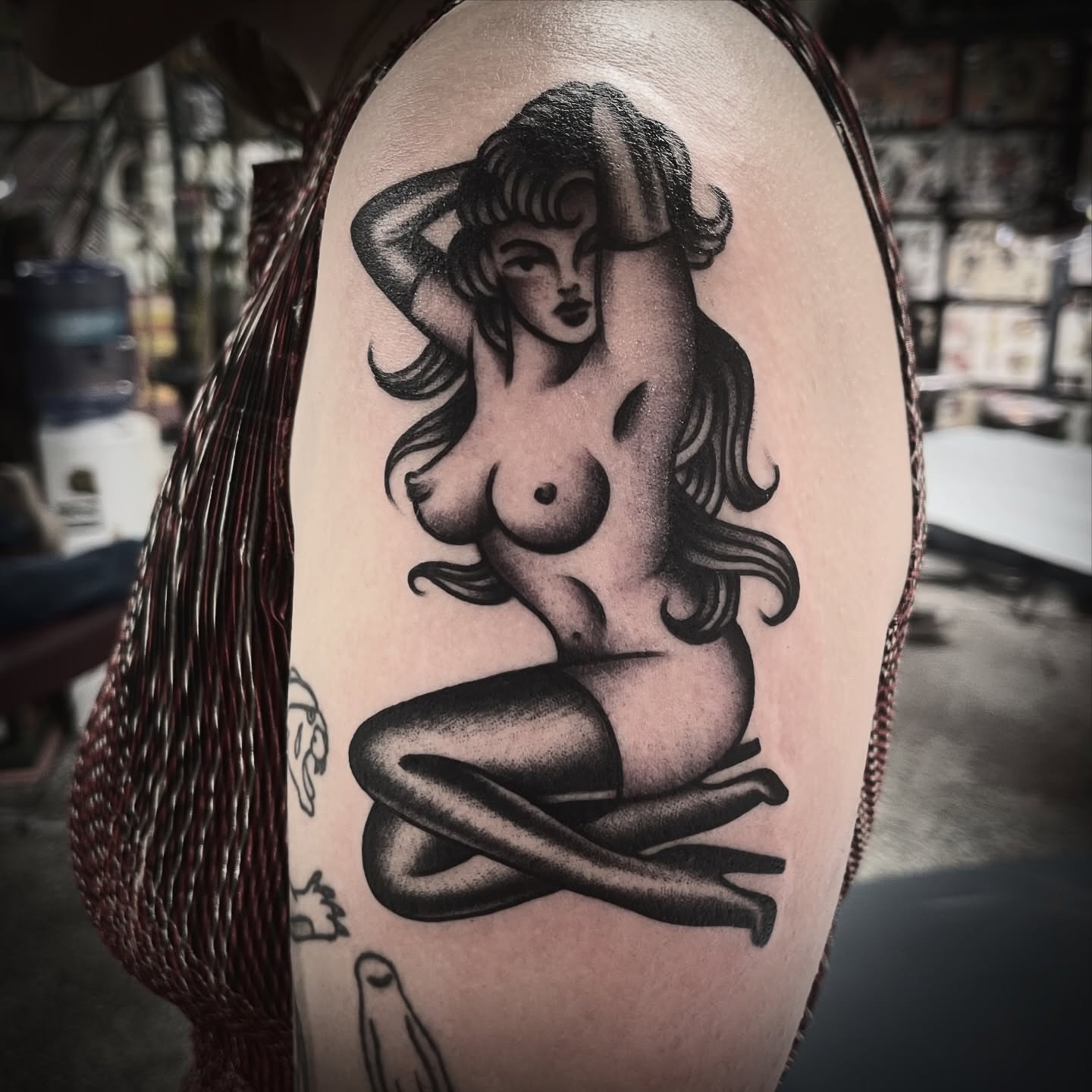 Nude woman black and grey tattoo on the shoulder by Deya Aven, Nashville, Tennessee