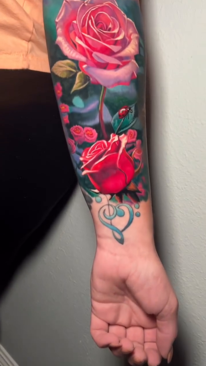 Roses and butterflies realism tattoo by Sean Foy