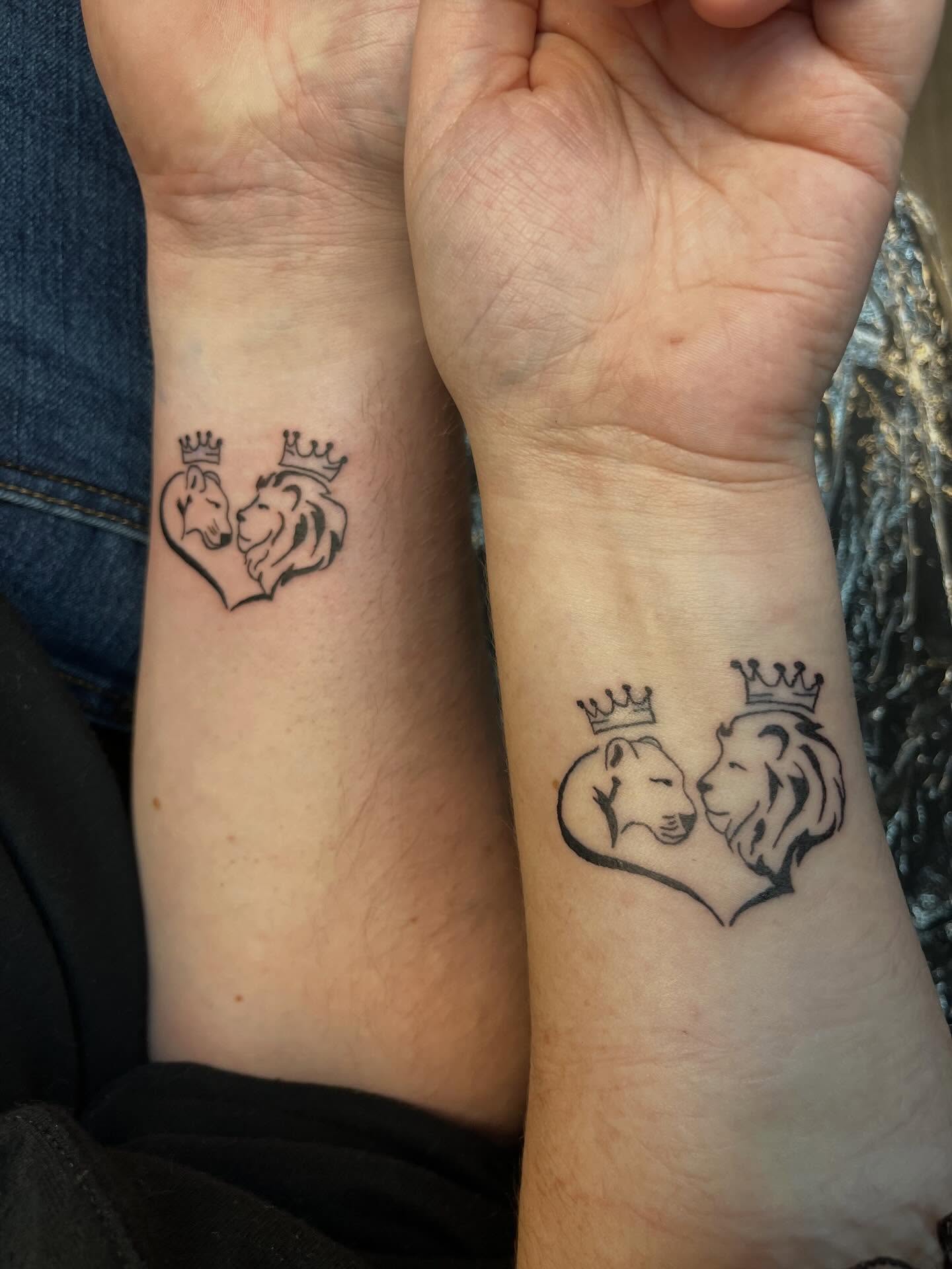 Lion and wolf black and grey tattoo on the forearm by XoXandrea.Ink, Kansas City, Missouri