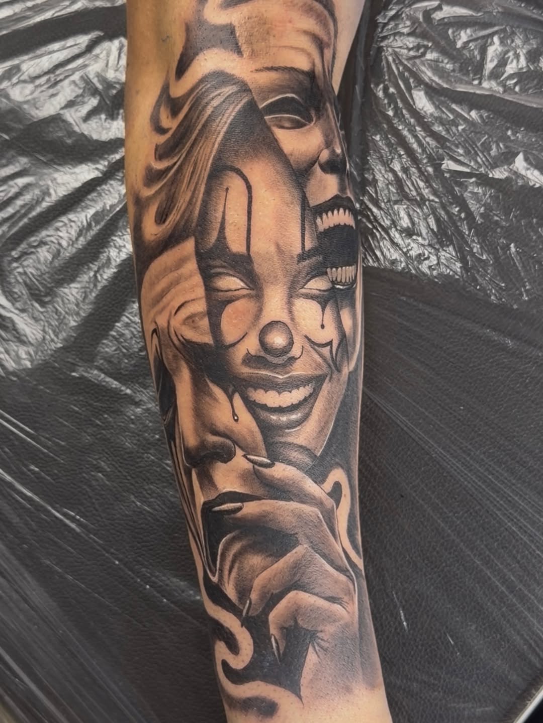 Masks and clown faces realism tattoo on the forearm by 🐺