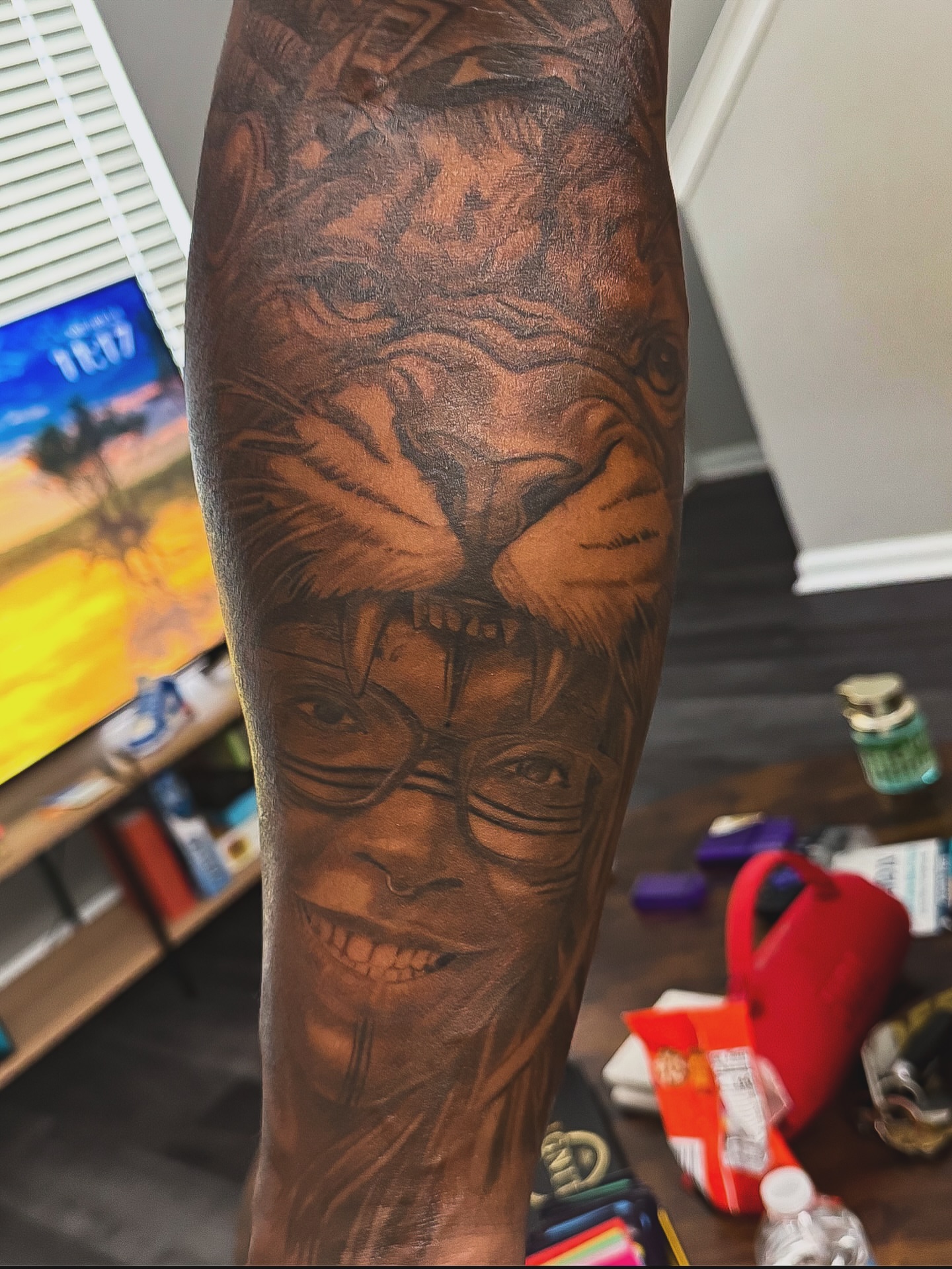 Lion and man realism tattoo on the forearm by Quinten Harper