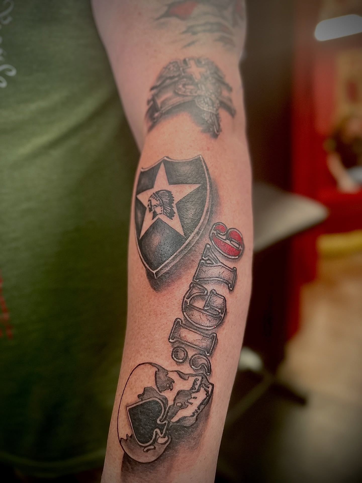 Botafogo logo black and grey tattoo on the forearm by Ricky Flemate, San Antonio