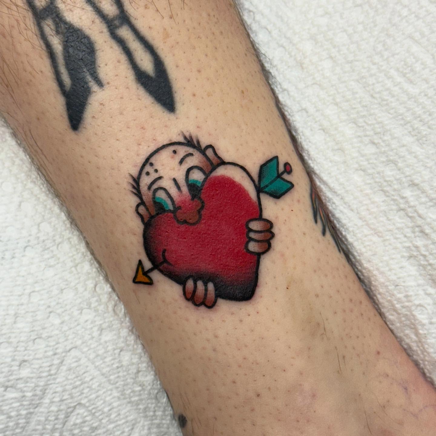 Heart with baby dotwork tattoo on the forearm by Ben