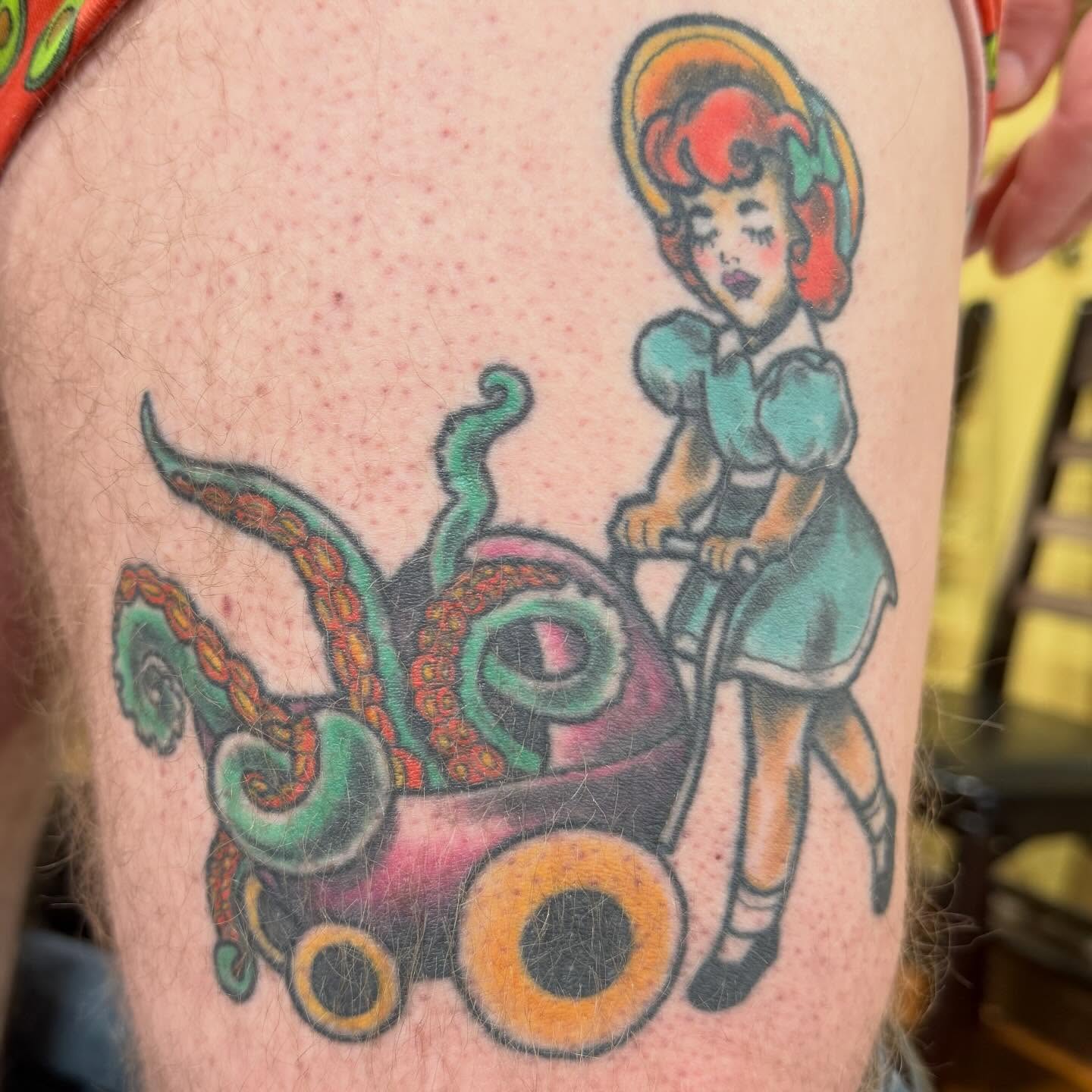 Octopus and girl American traditional tattoo on the thigh by Erin McDavis