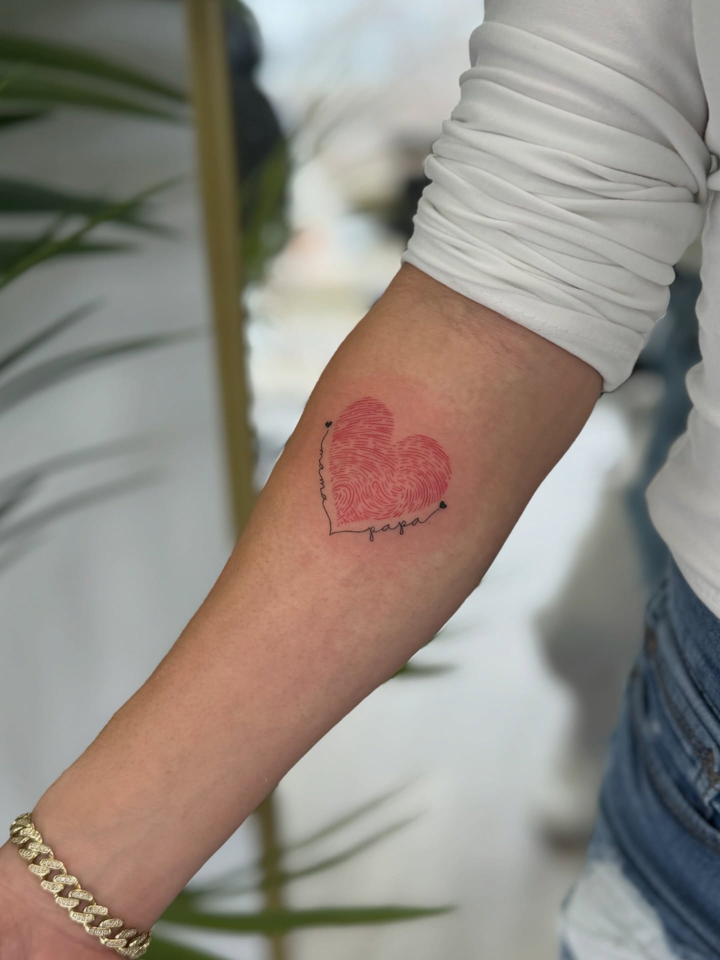 Fingerprint heart dotwork tattoo on the forearm by Daniel Montoya, Charlotte, North Carolina
