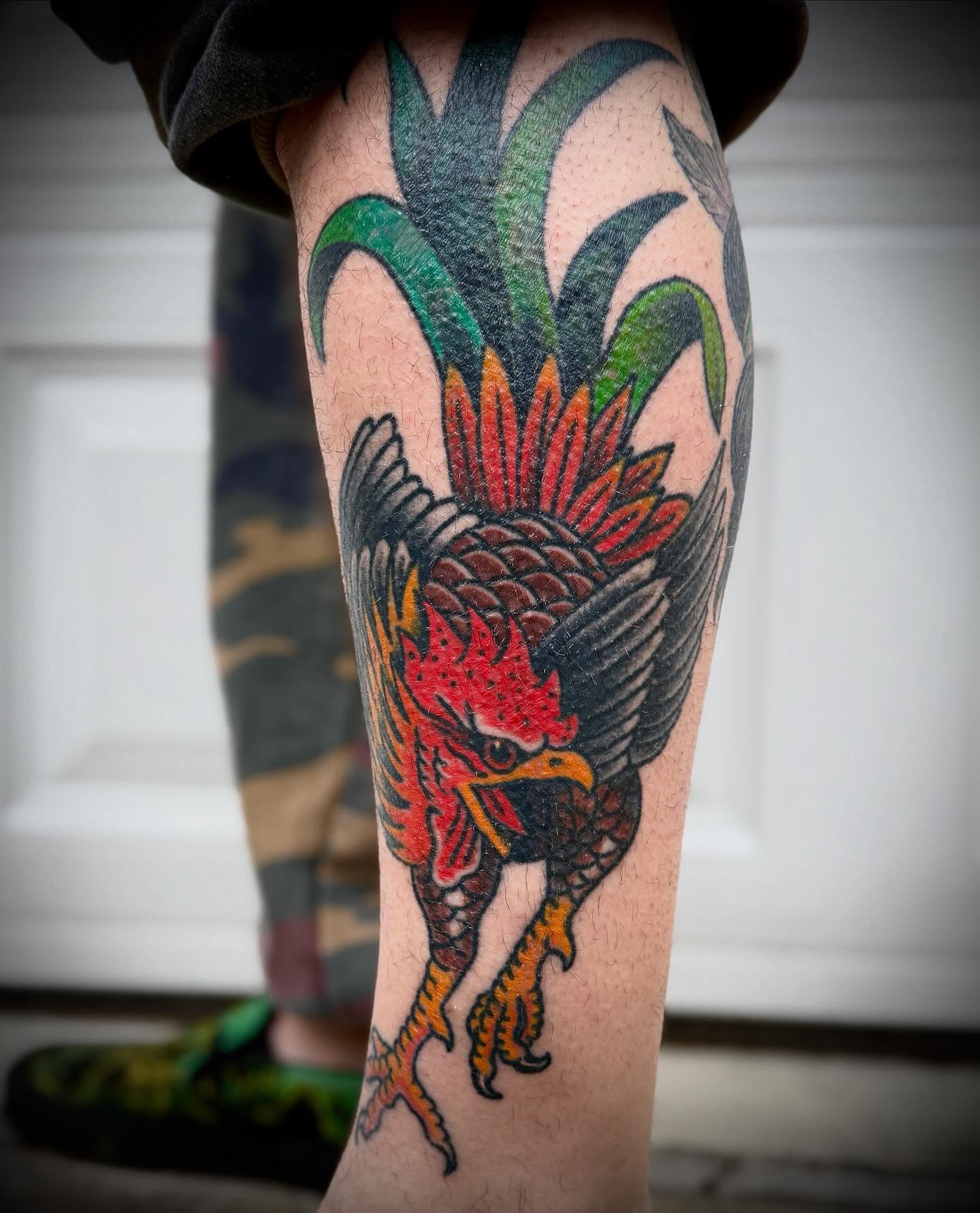 Rooster and pineapple American traditional tattoo on the calf by Hayden Abernathy