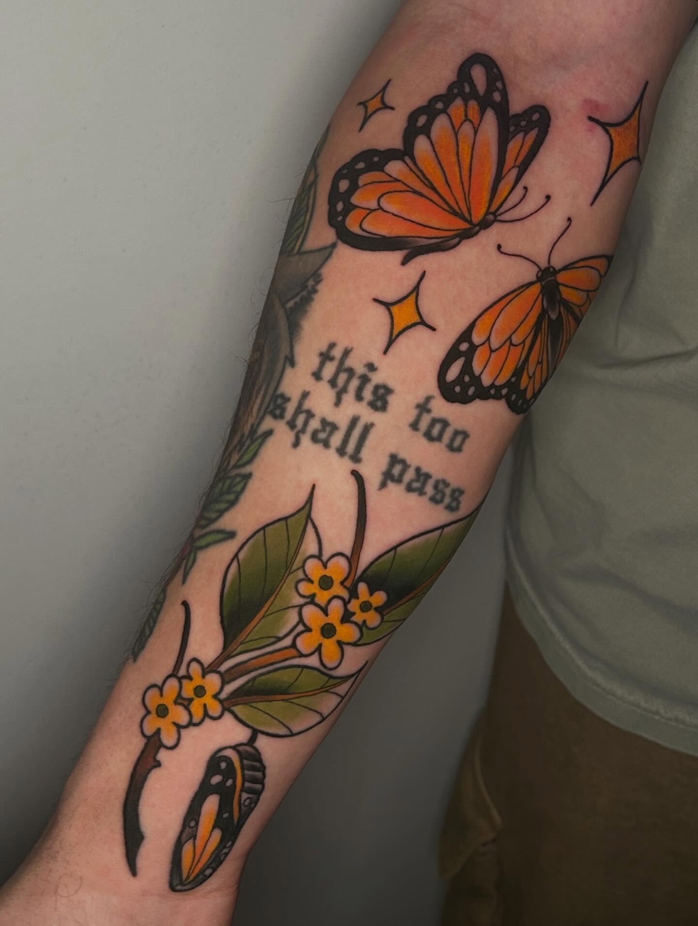 Monarch butterflies and flowers American traditional tattoo on the forearm by 𝕸𝖞𝖆
