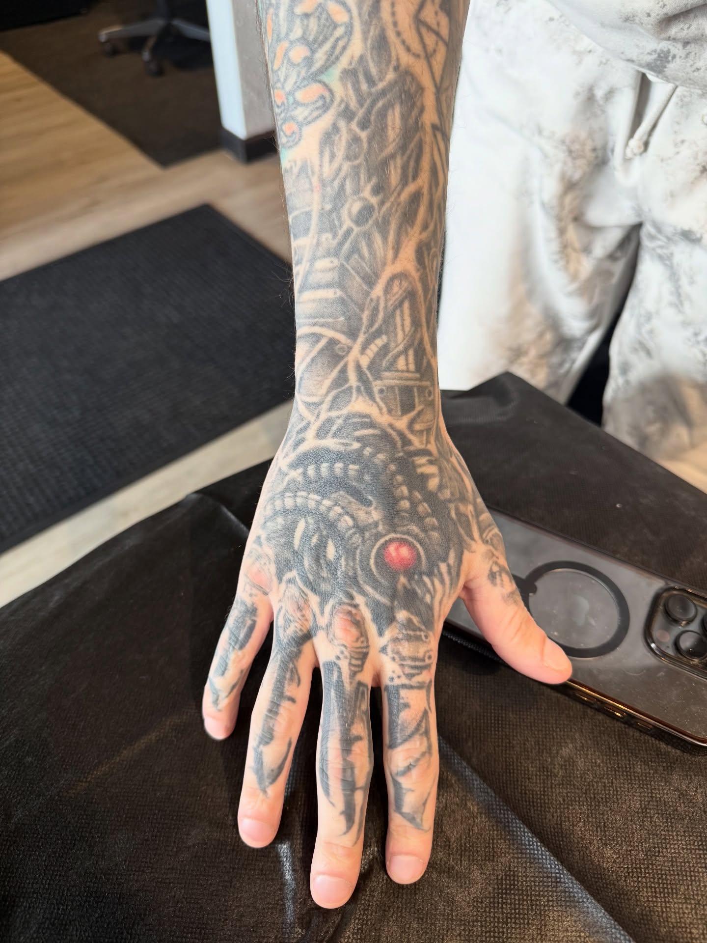 Cyborg hand geometric tattoo on the hand by Joe Weber, Monona, Wisconsin