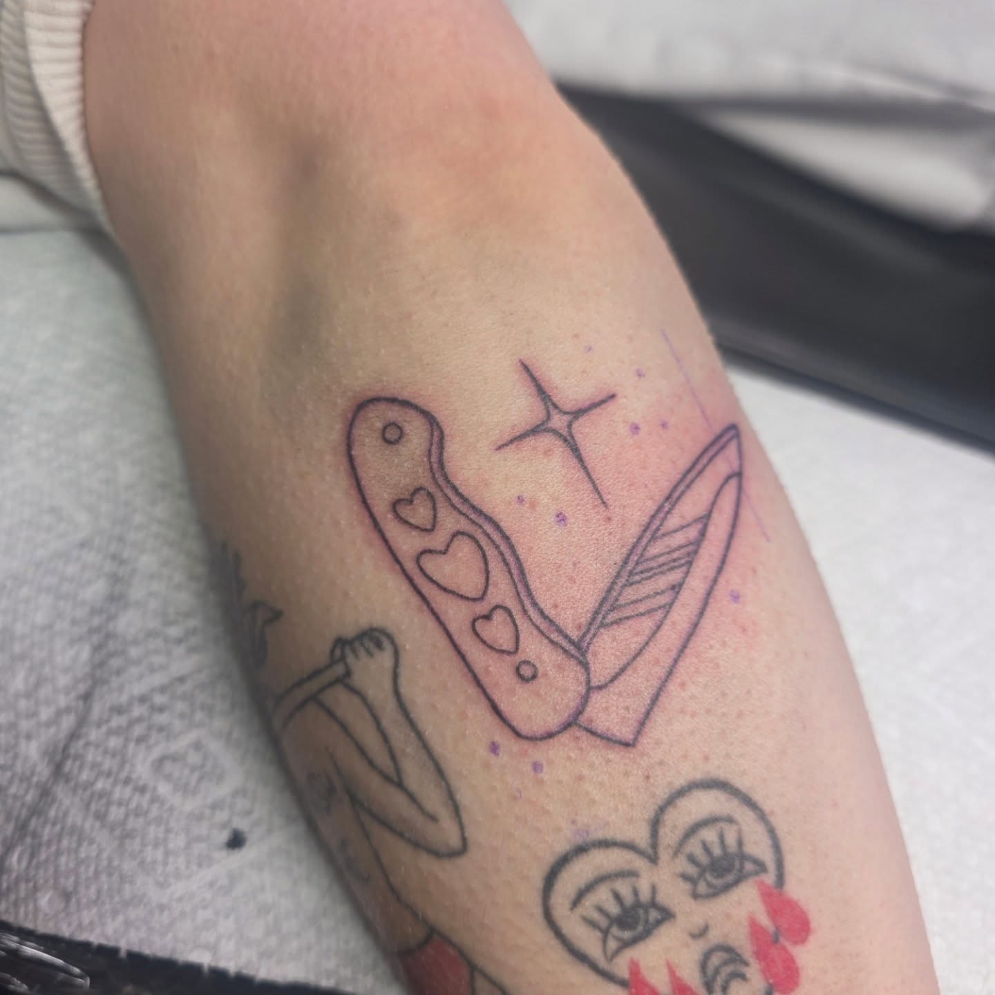 Heart-shaped knife dotwork tattoo on the forearm by Cassieal Welch