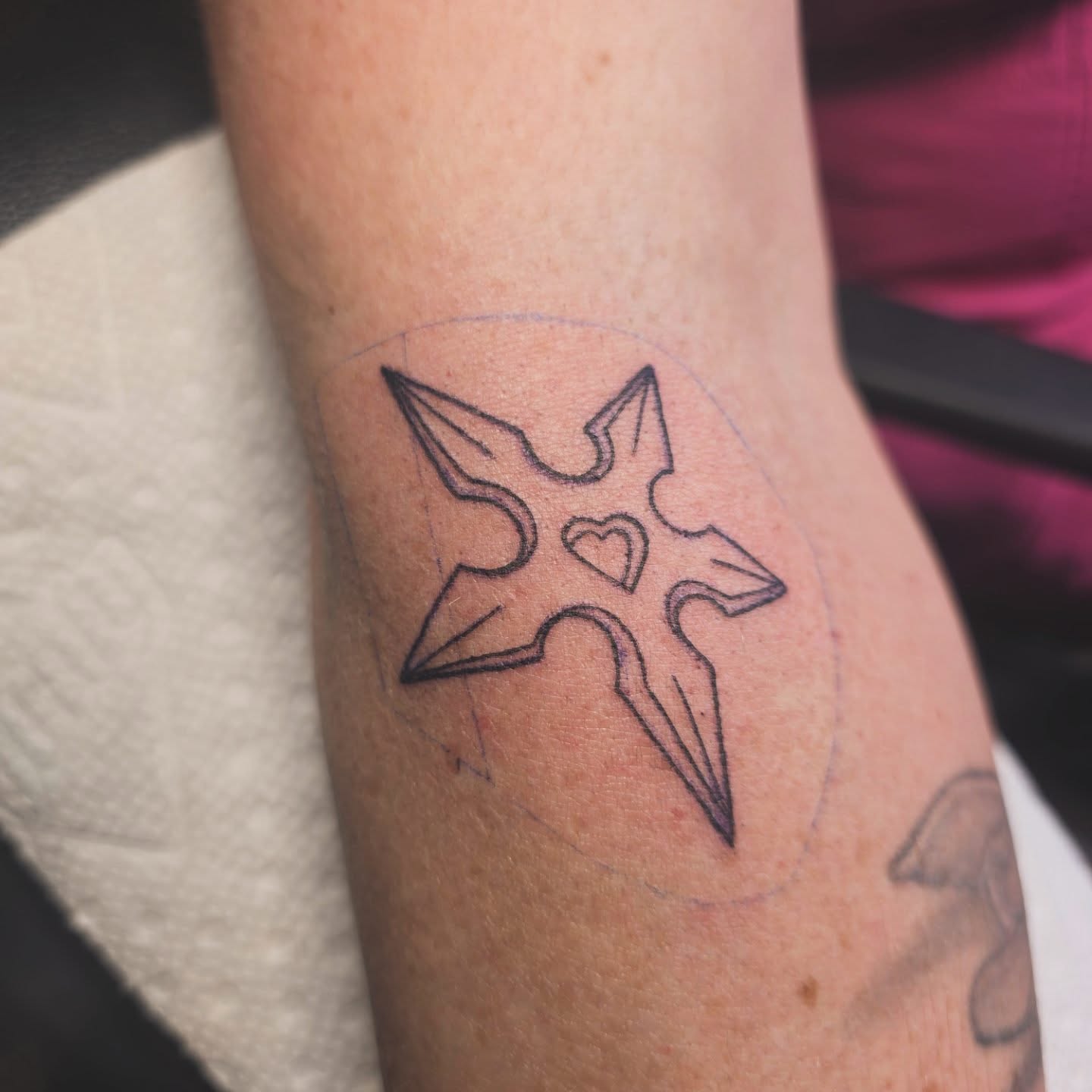 Cross with hearts geometric tattoo on the forearm by Cassieal Welch
