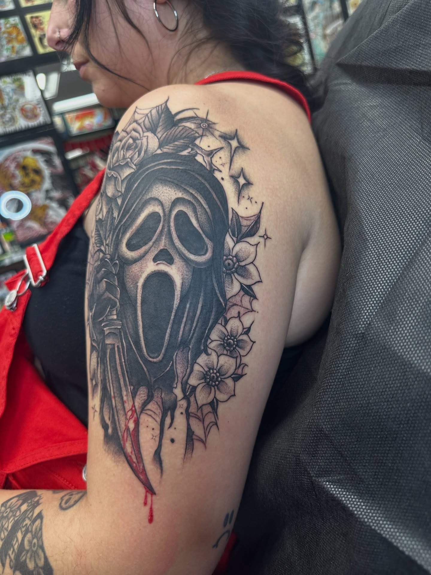 Scream mask black and grey tattoo on the shoulder by Stevie O'Dell