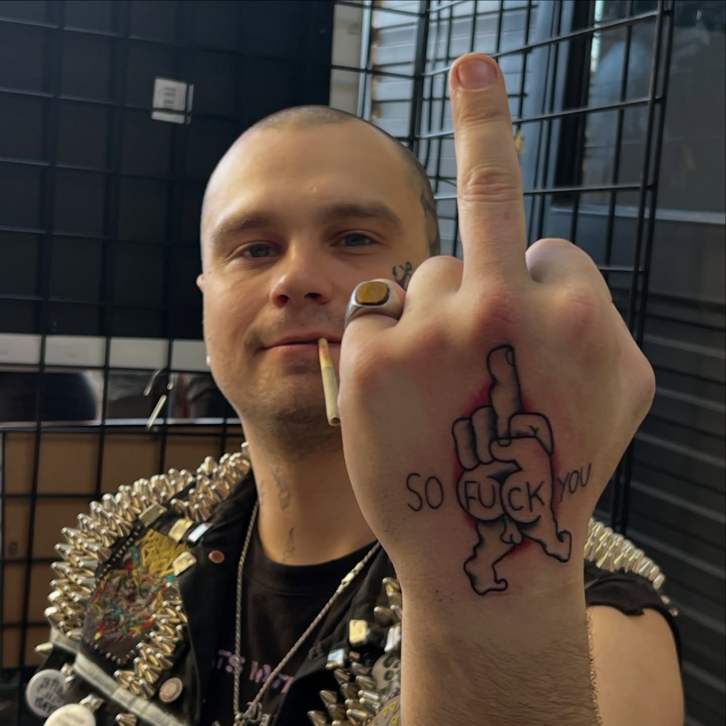 Finger with text lettering script tattoo on the hand by Bobby Tobin