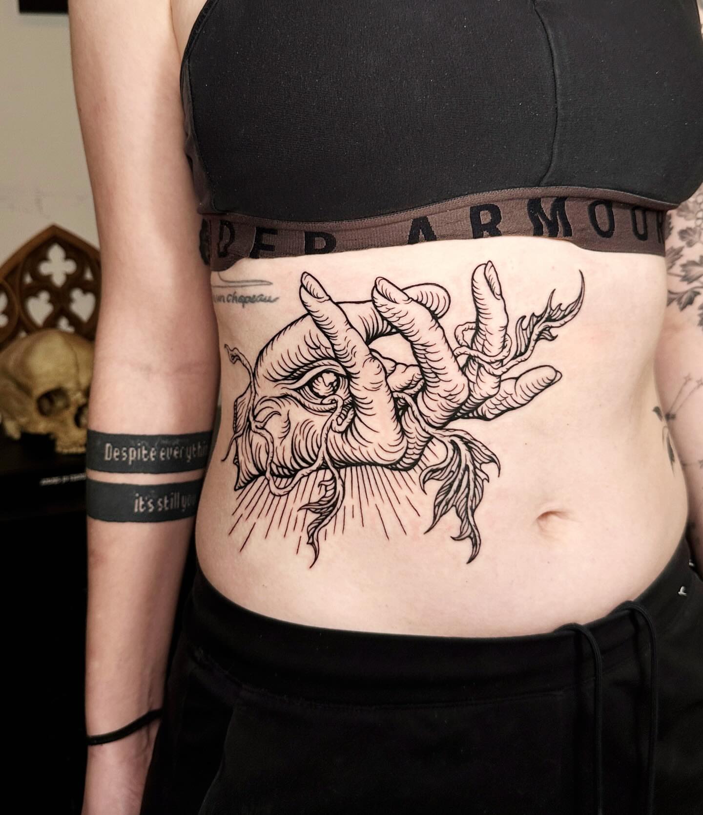 Man's face with hands black and grey tattoo on the ribs by 𝕾𝖆𝖘𝖍𝖆 𝖂𝖔𝖑𝖆𝖓𝖉