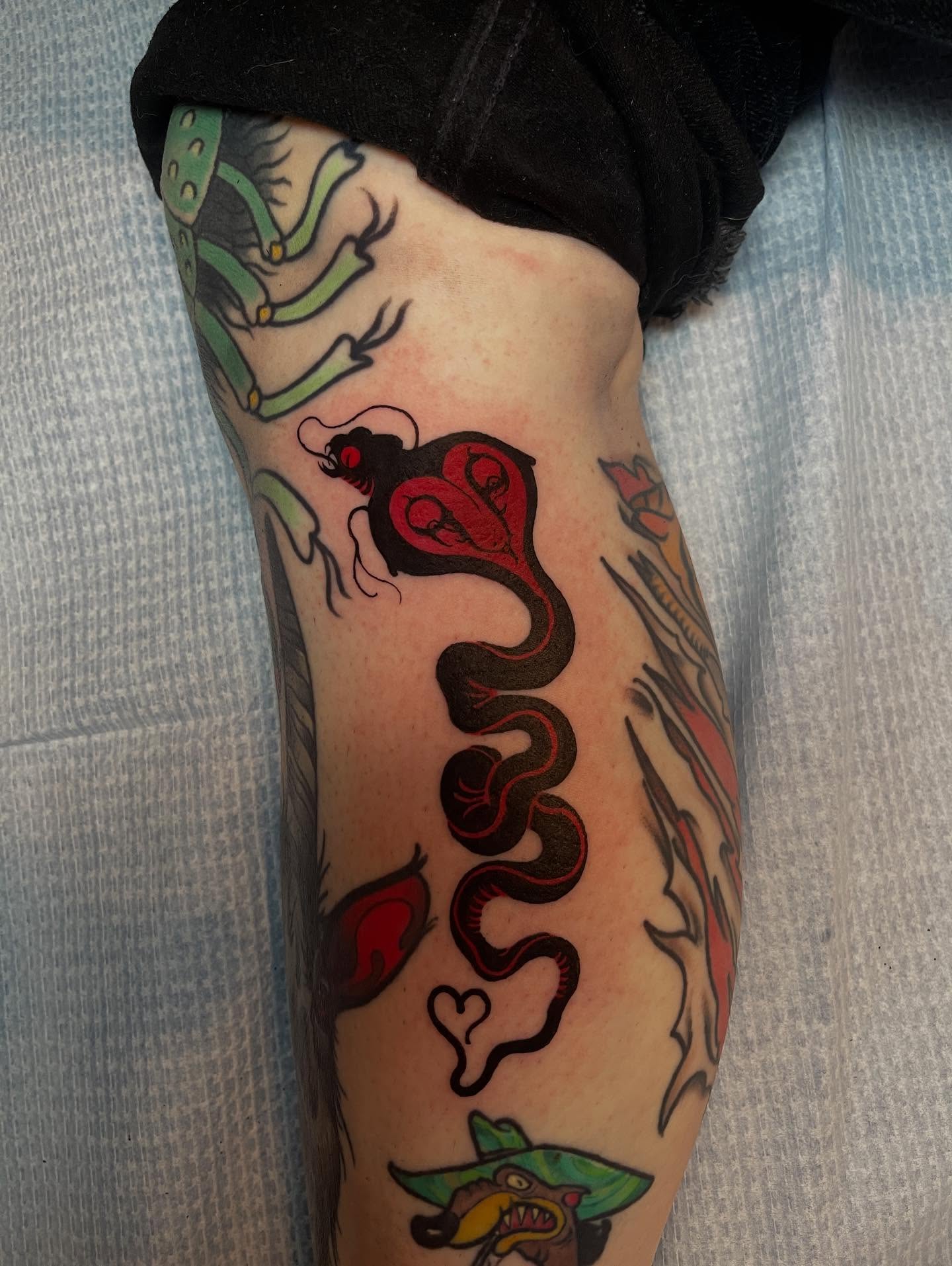 Snake American traditional tattoo on the forearm by Joe Moreira