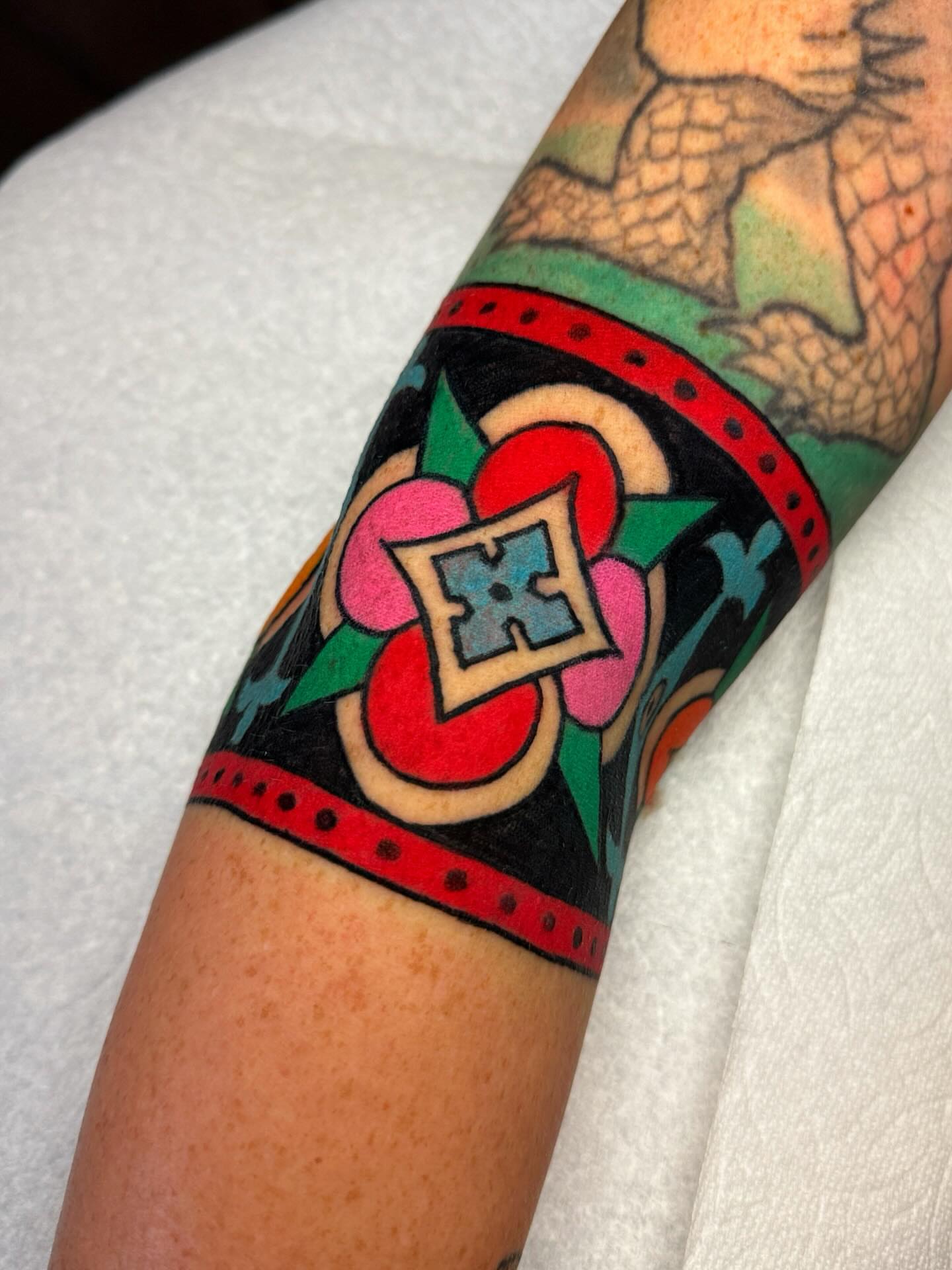 Geometric pattern geometric tattoo on the forearm by Britt Kuechenmeister, Culver City, California