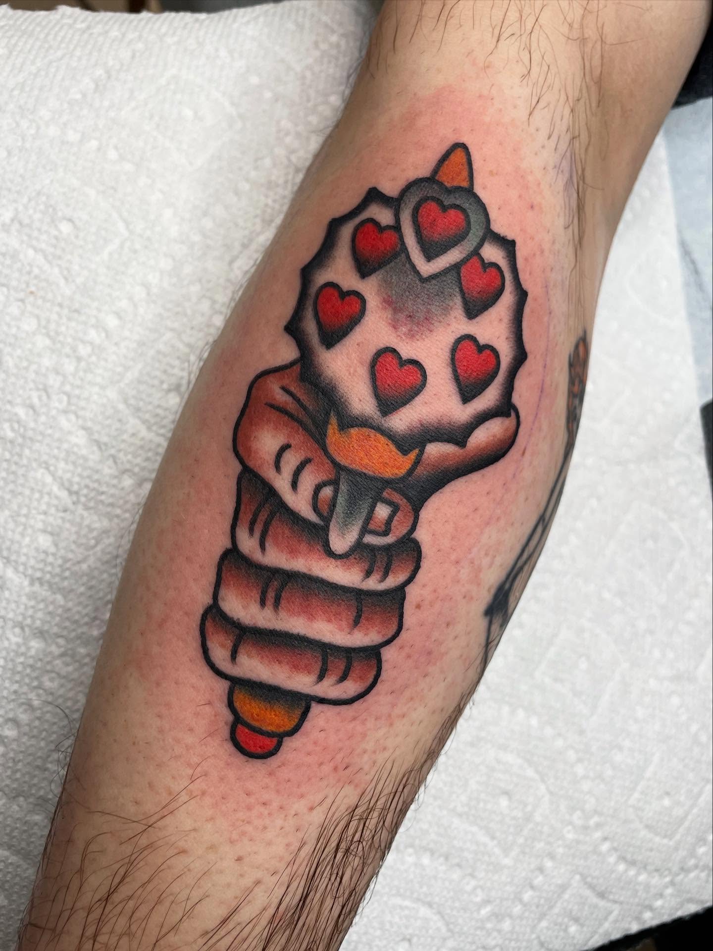 Heart-shaped hammer American traditional tattoo on the forearm by Kat, Sacramento, California