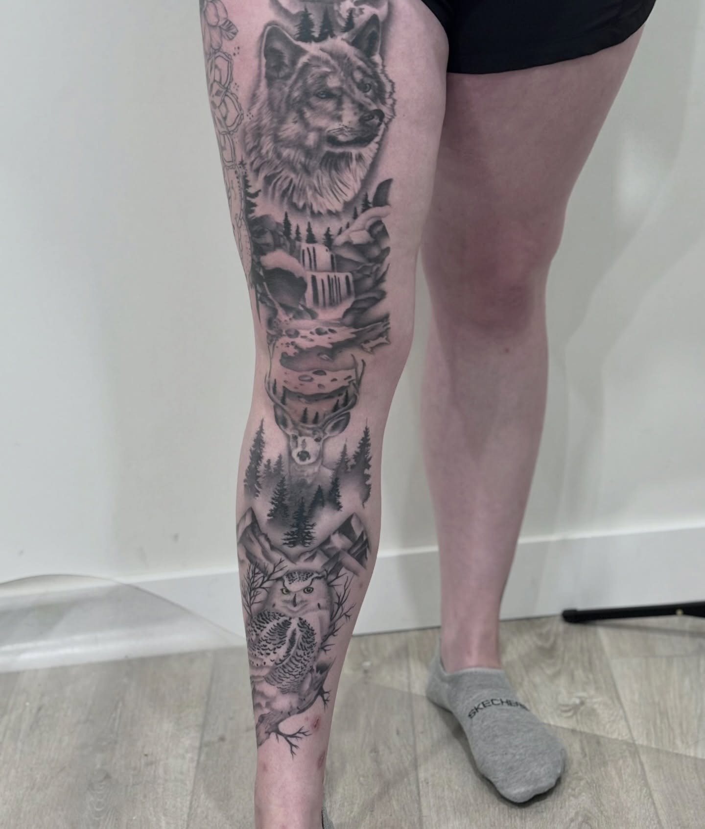 Wolf and waterfall realism tattoo on the calf by Elise Lamoureux- Tattoo Artist, Airdrie, Alberta