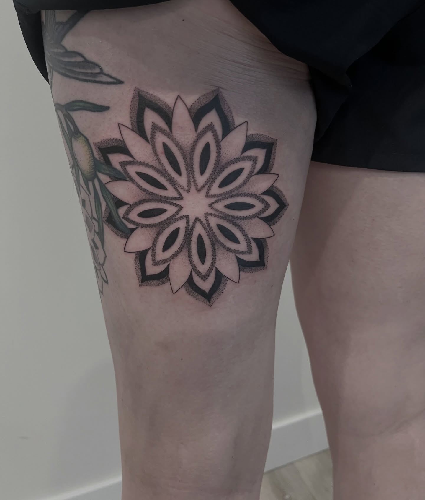Geometric flower geometric tattoo on the thigh by Elise Lamoureux- Tattoo Artist, Airdrie, Alberta