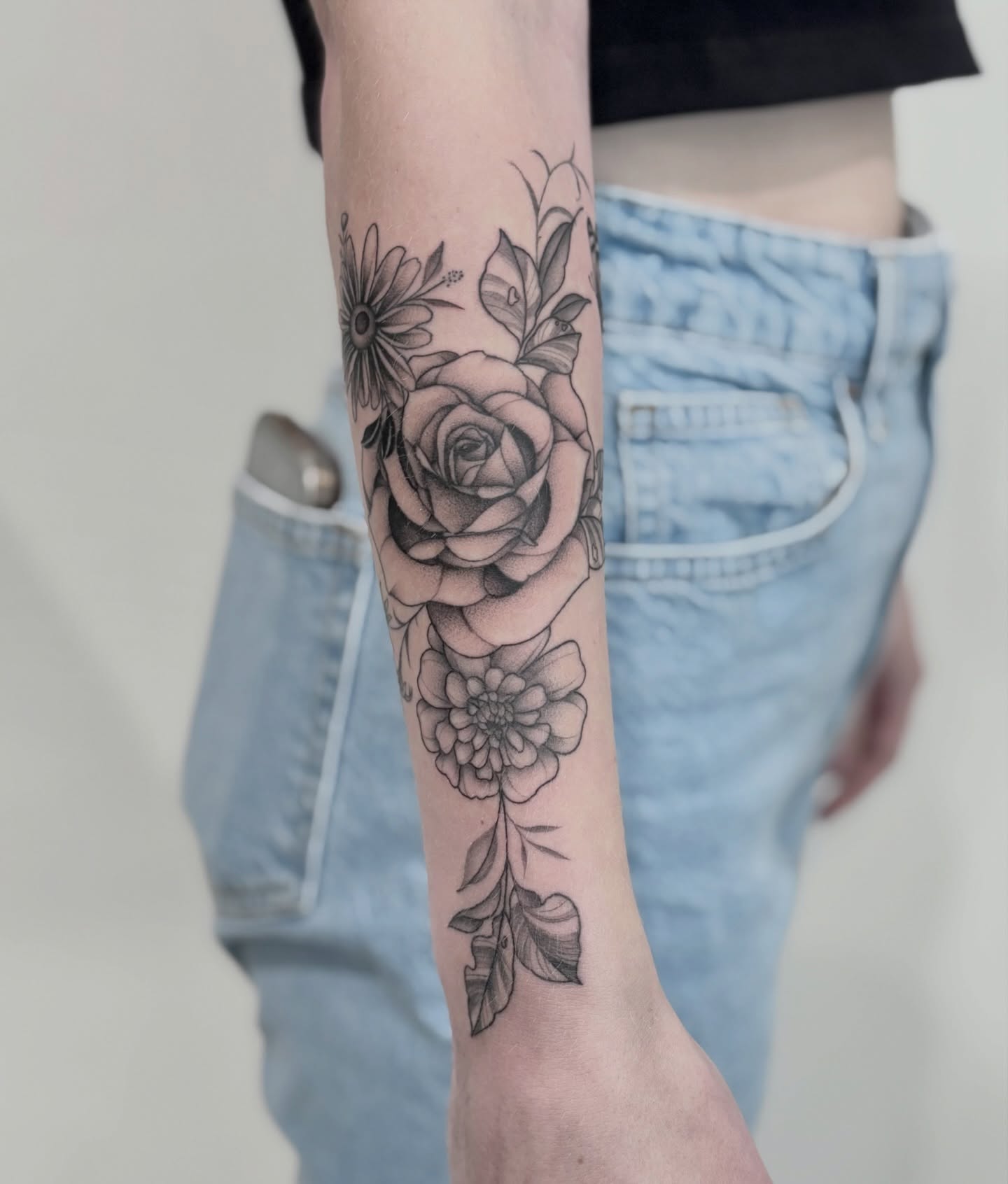 Floral arrangement black and grey tattoo on the forearm by Elise Lamoureux- Tattoo Artist, Airdrie, Alberta