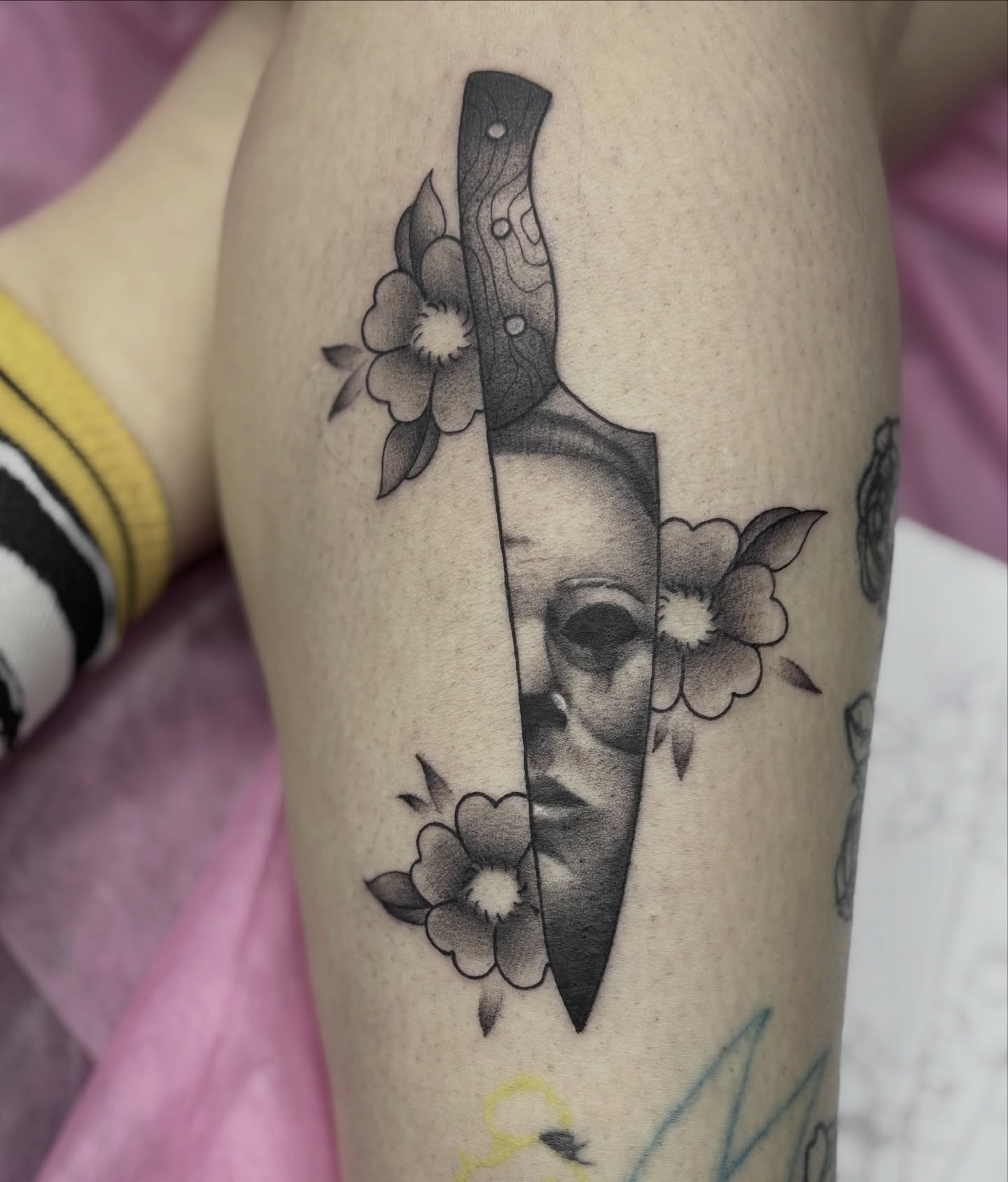 Knife and face realism tattoo on the forearm by Elise Lamoureux- Tattoo Artist, Airdrie, Alberta