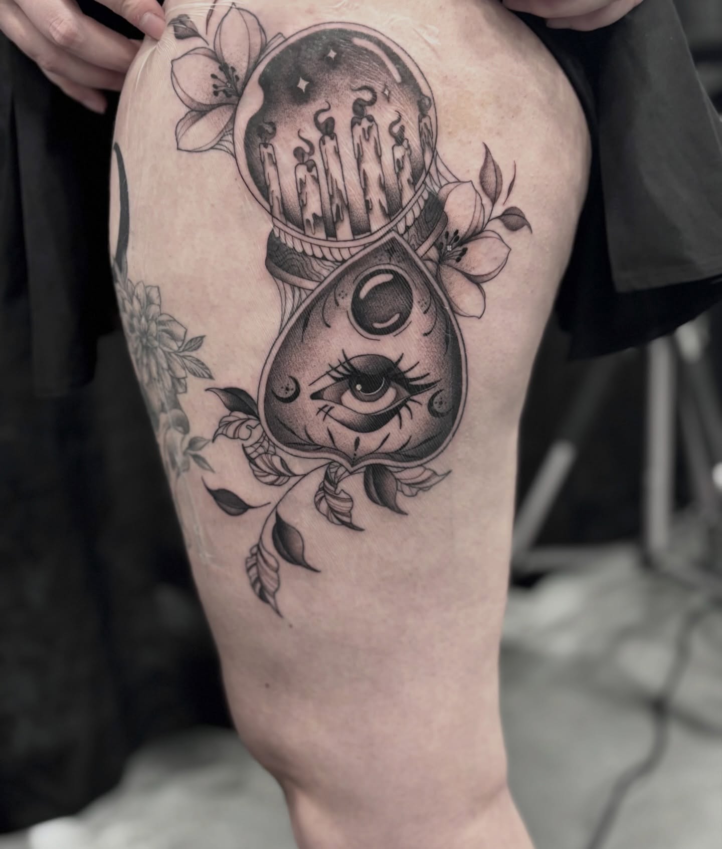Eye and candles realism tattoo on the thigh by Elise Lamoureux- Tattoo Artist, Airdrie, Alberta