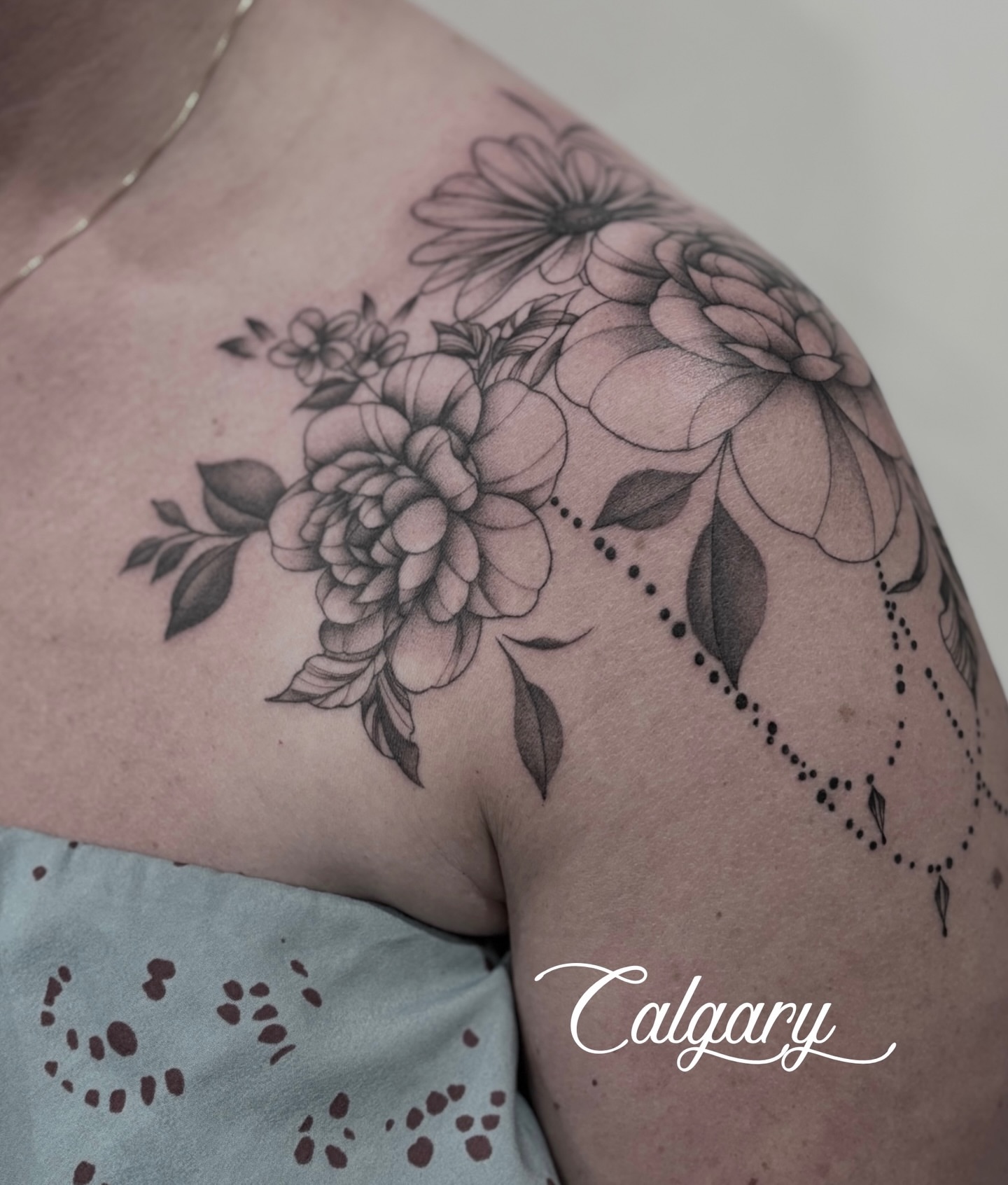 Floral bouquet dotwork tattoo on the shoulder by Elise Lamoureux- Tattoo Artist, Airdrie, Alberta