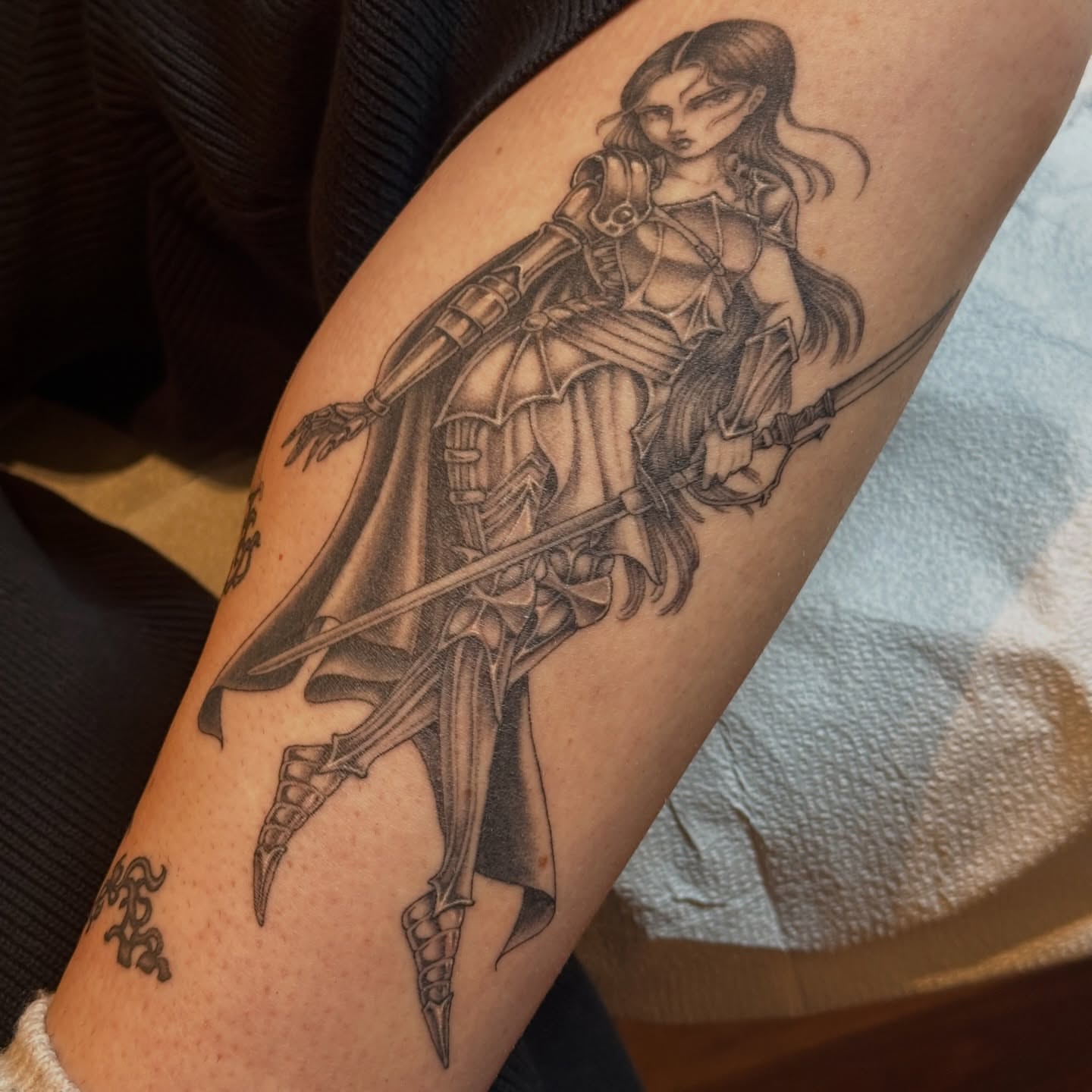Female warrior realism tattoo on the forearm by Bree Lin