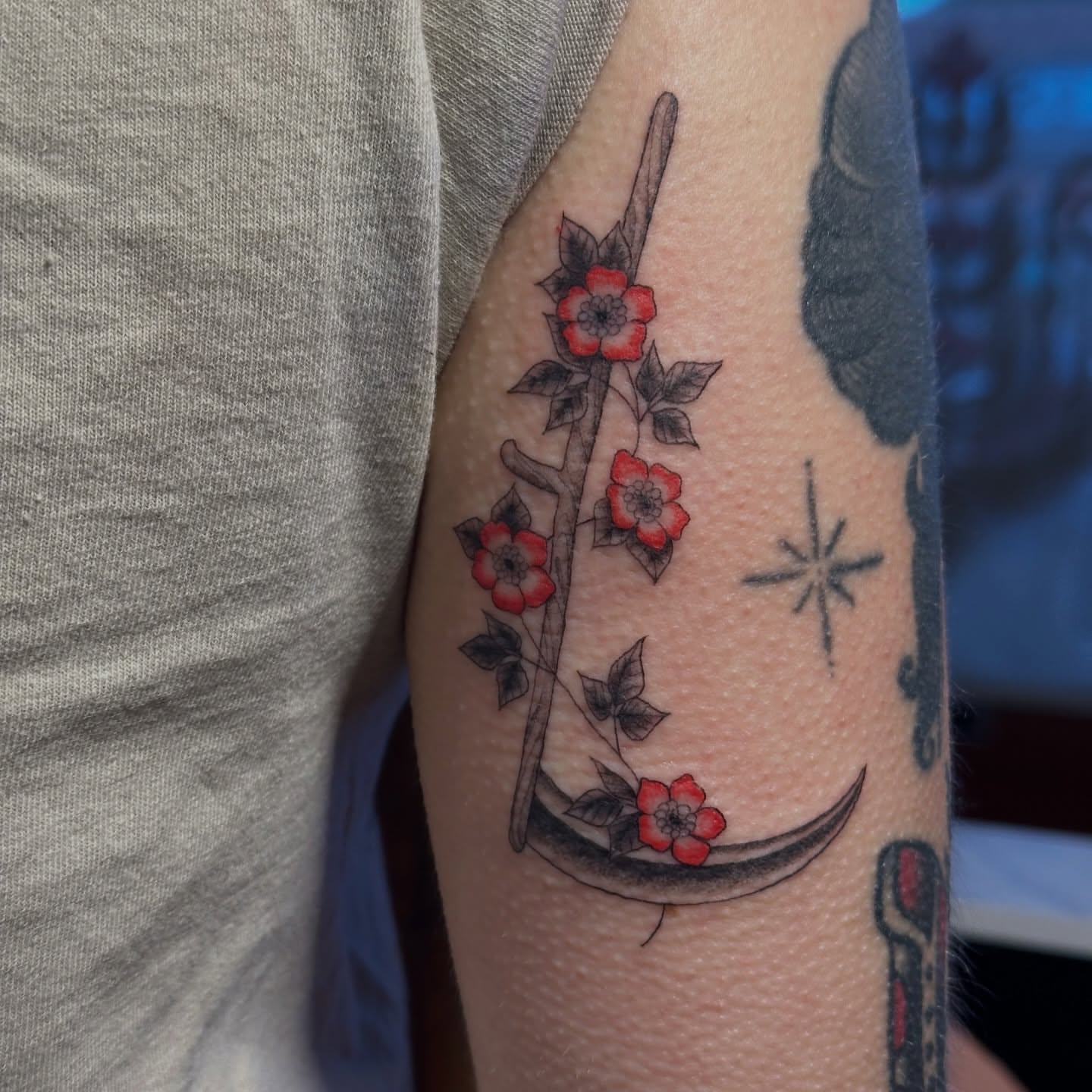 Cherry blossoms and sword japanese irezumi tattoo on the forearm by Bree Lin