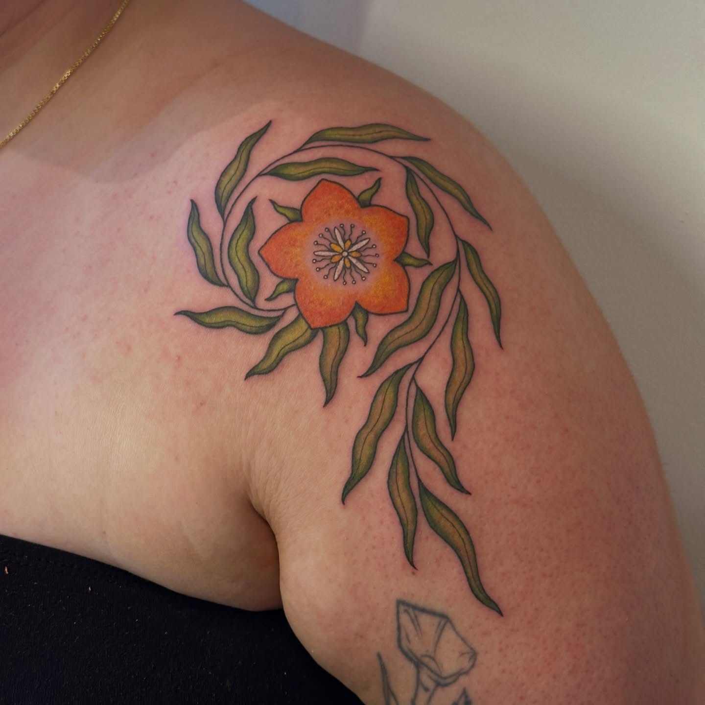 Orange flower new school tattoo on the shoulder by Bree Lin